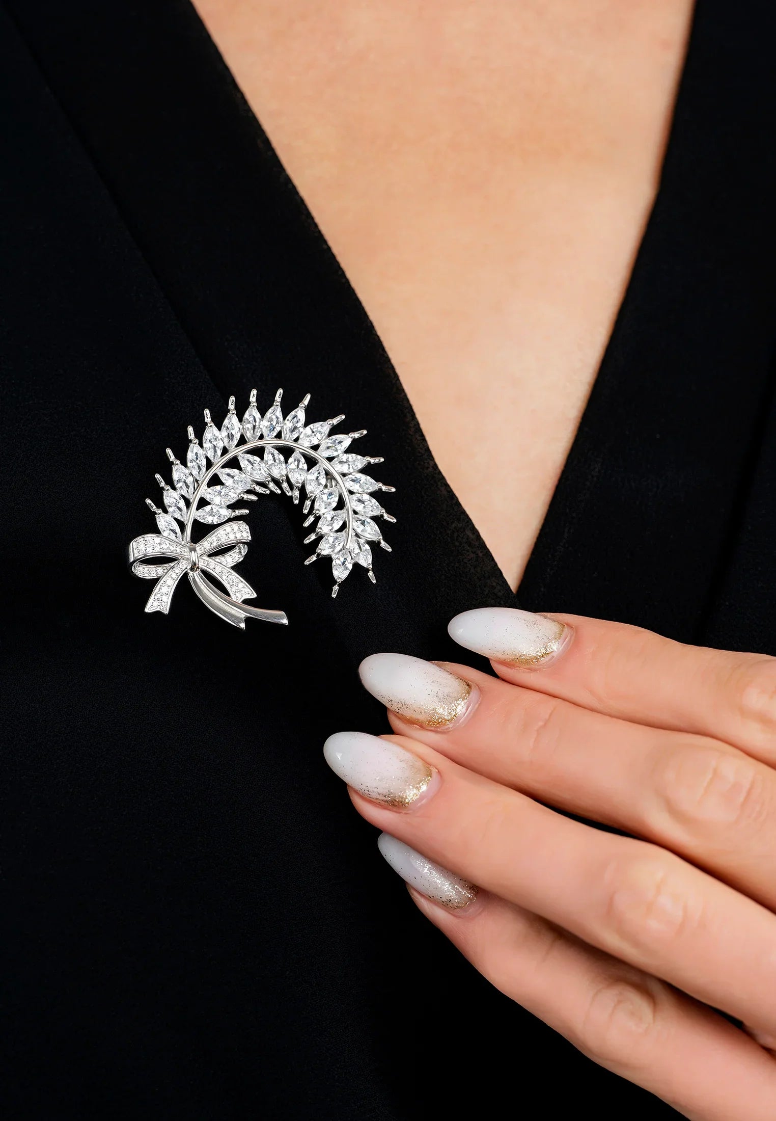 The brooch worn by a model.