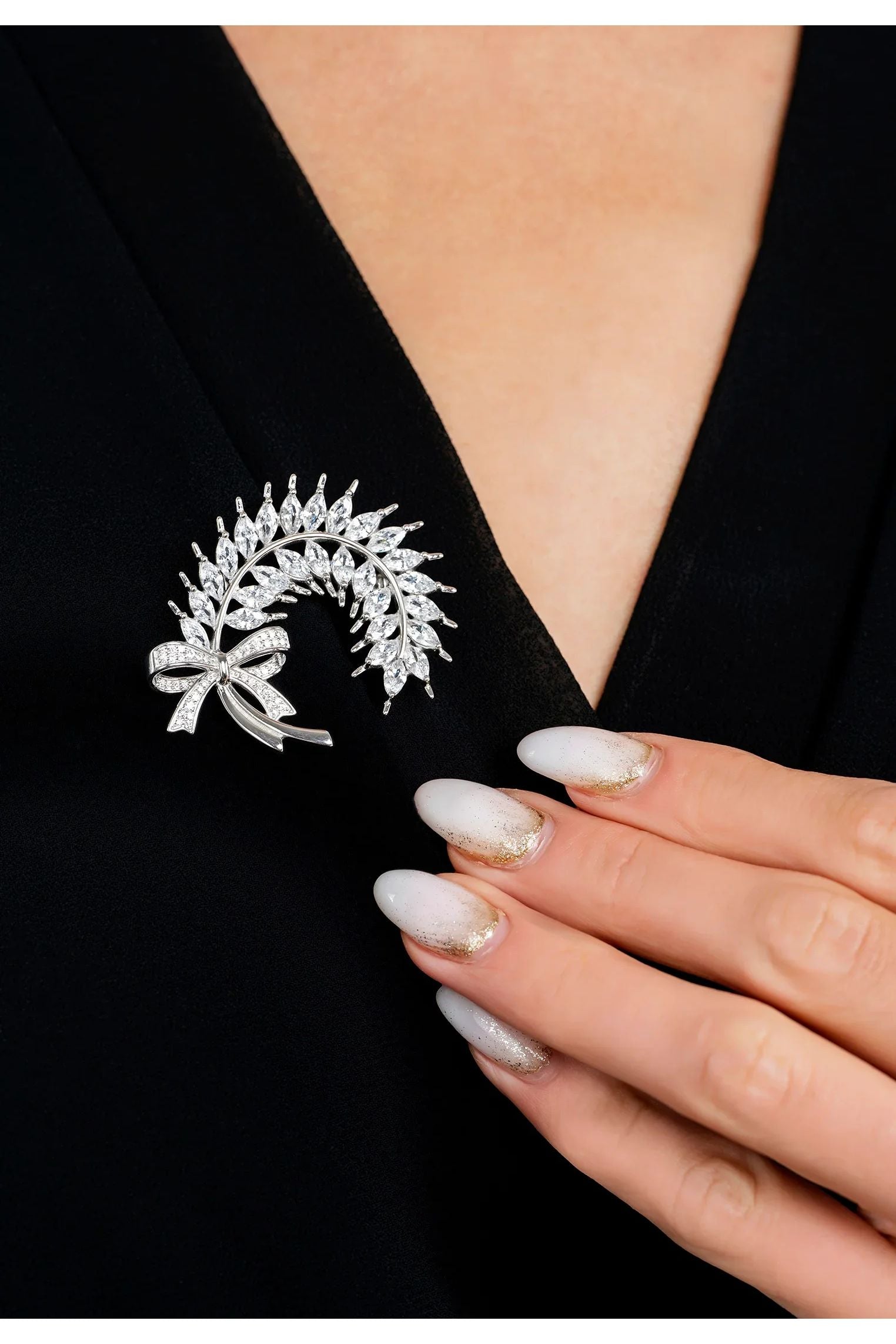 The brooch worn by a model.