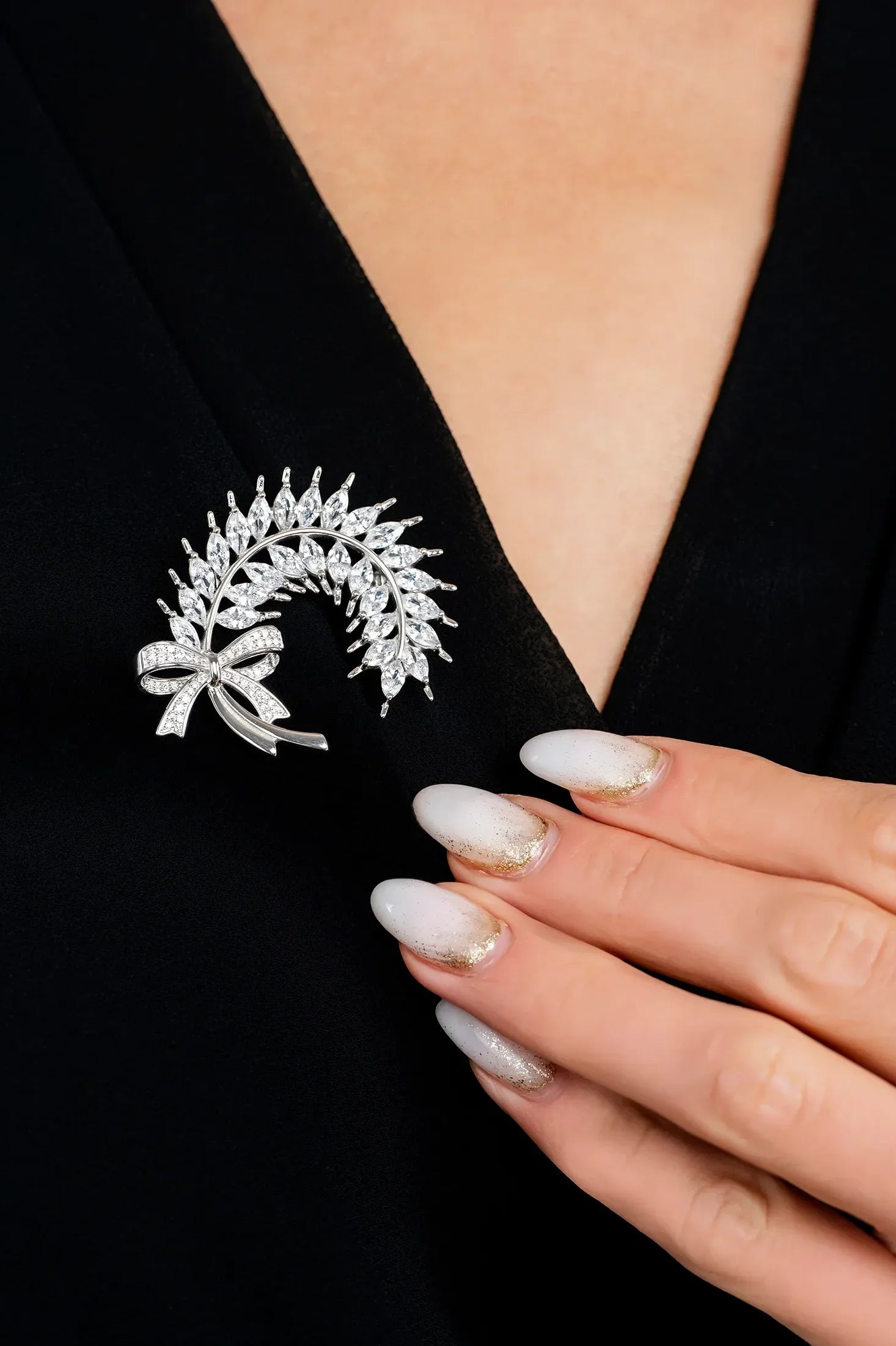 The brooch worn by a model.