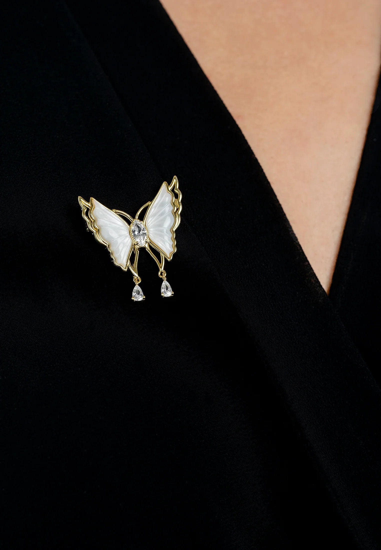 The brooch worn by a model.