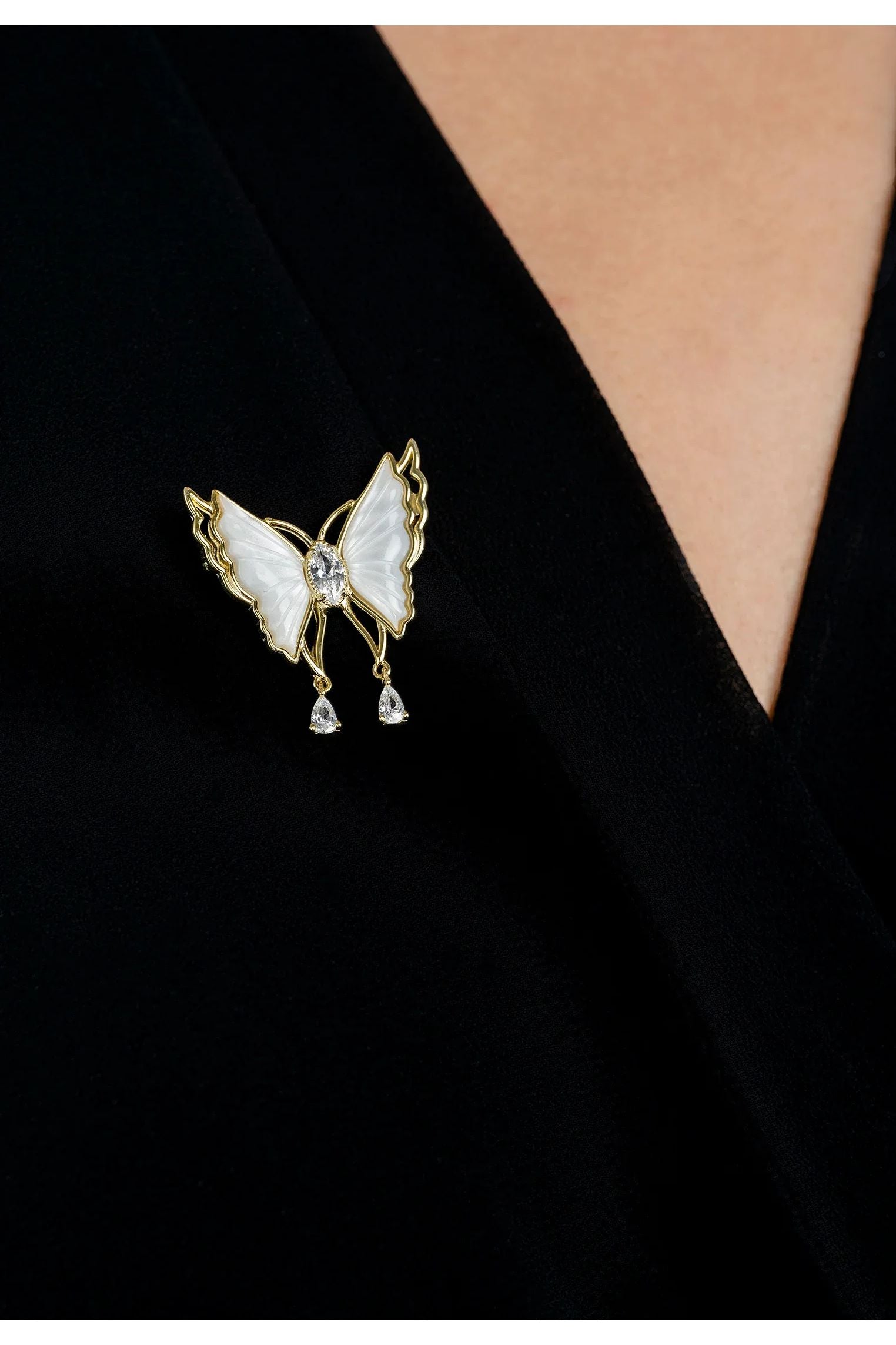 The brooch worn by a model.