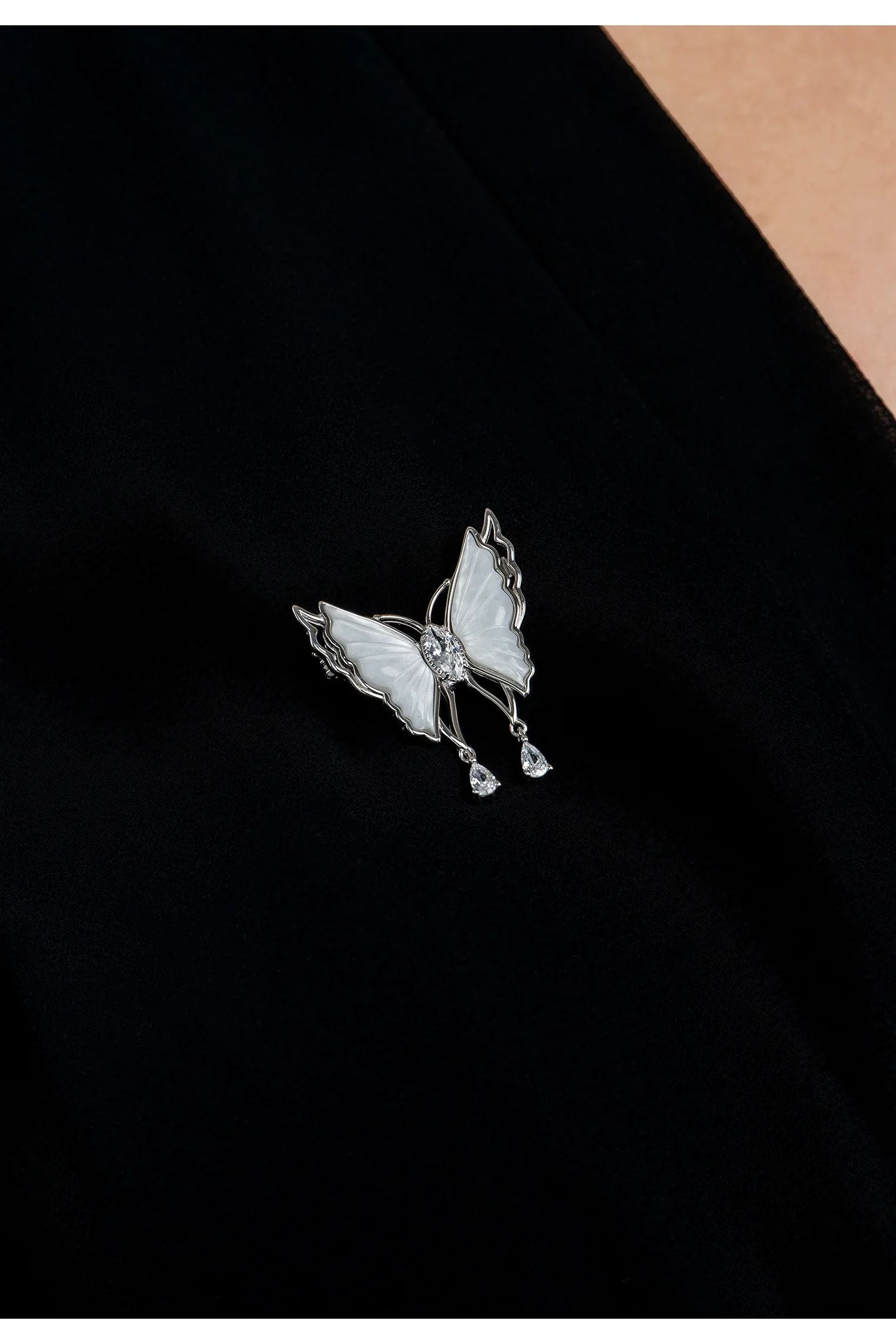 The brooch worn by a model.
