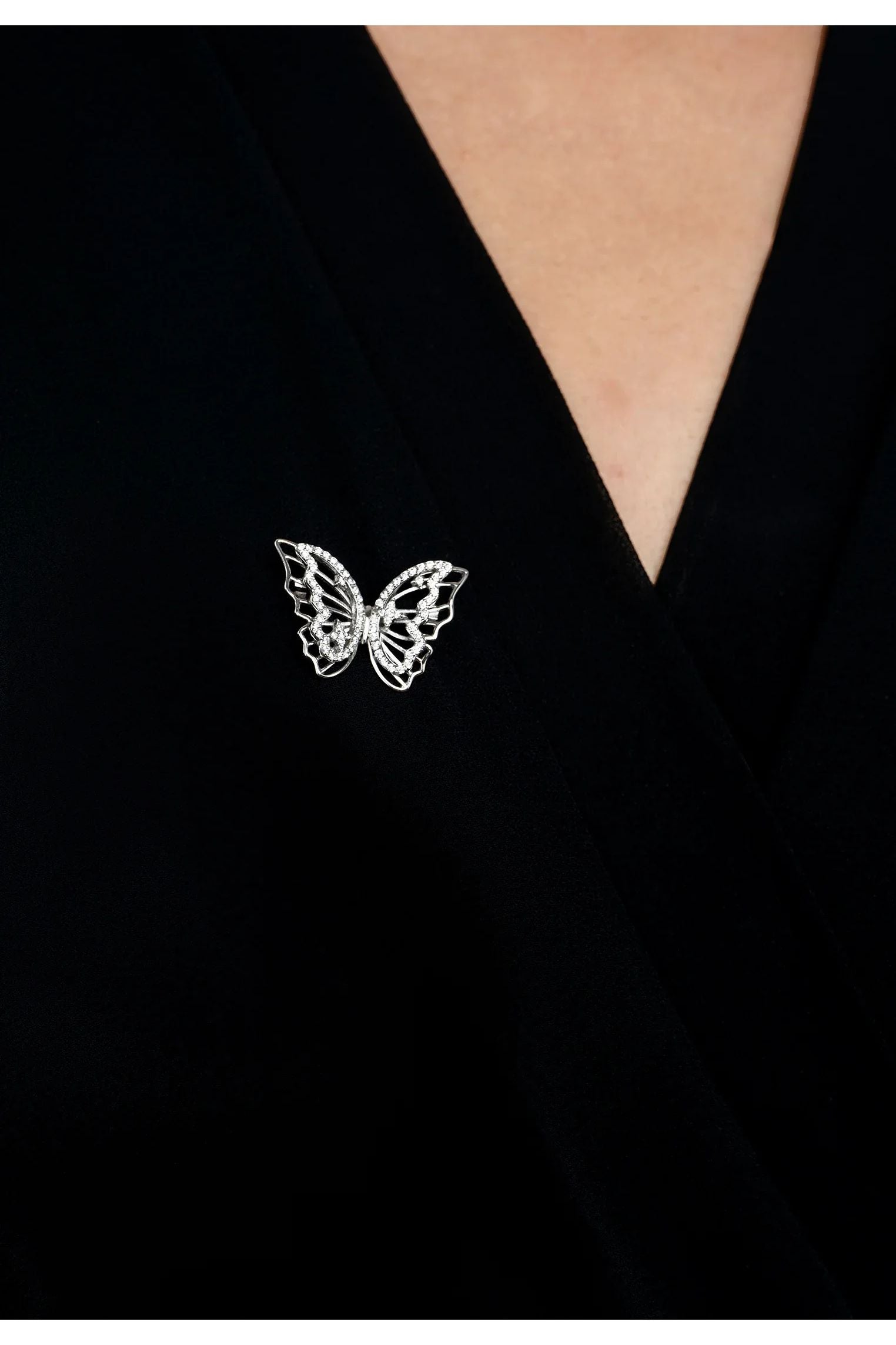 The brooch worn by a model.