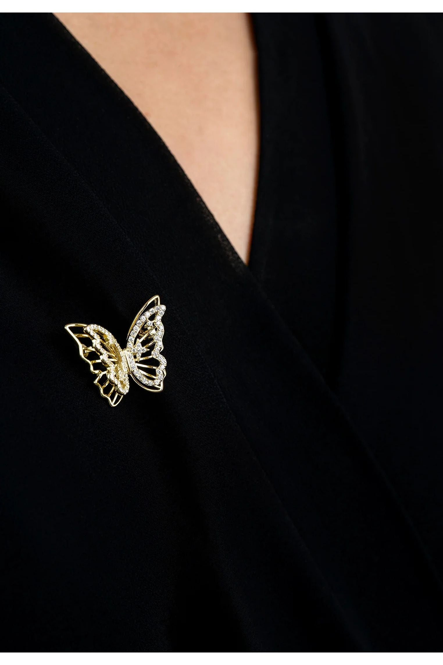 The brooch worn by a model.