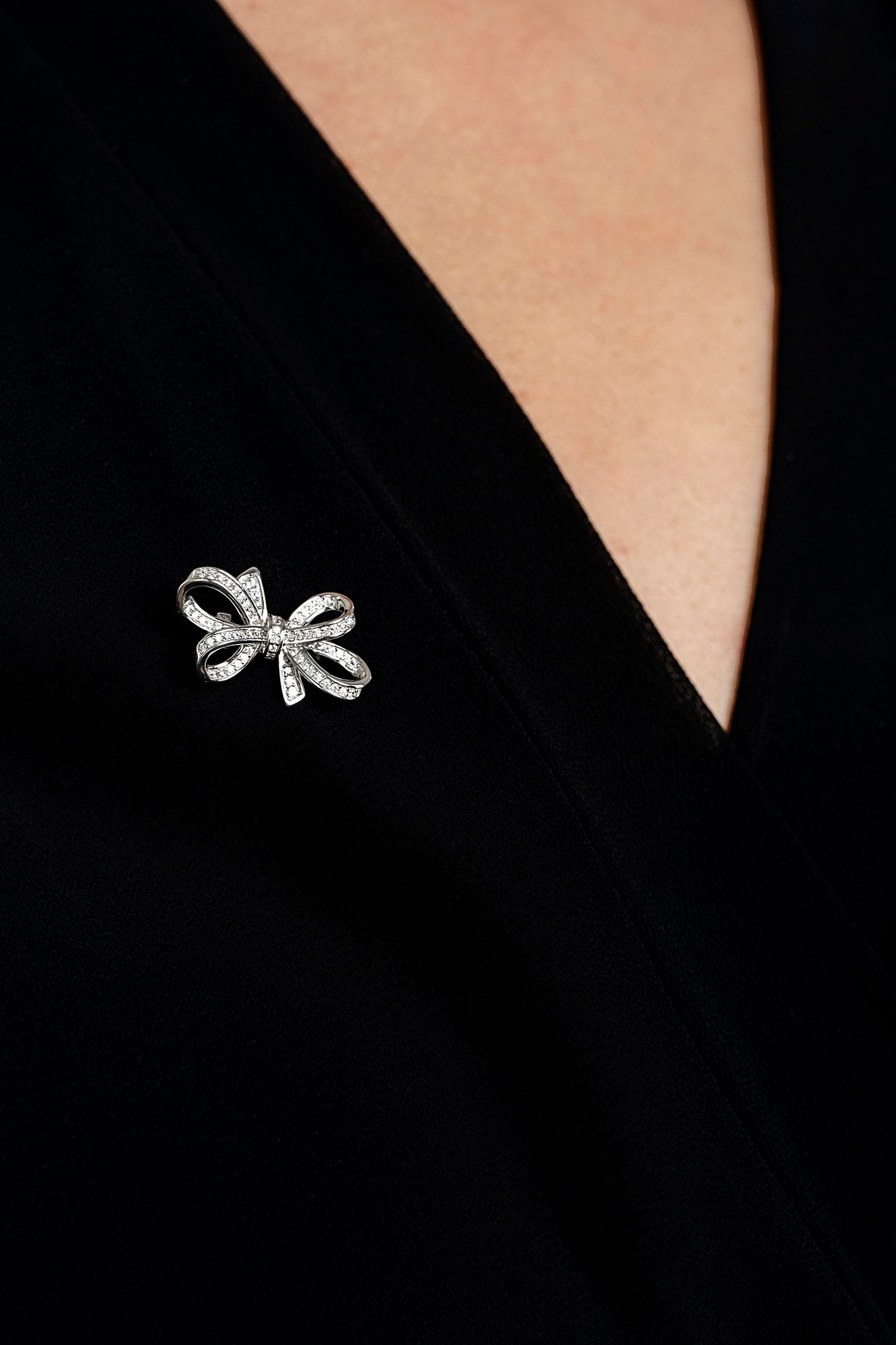The brooch worn by a model.