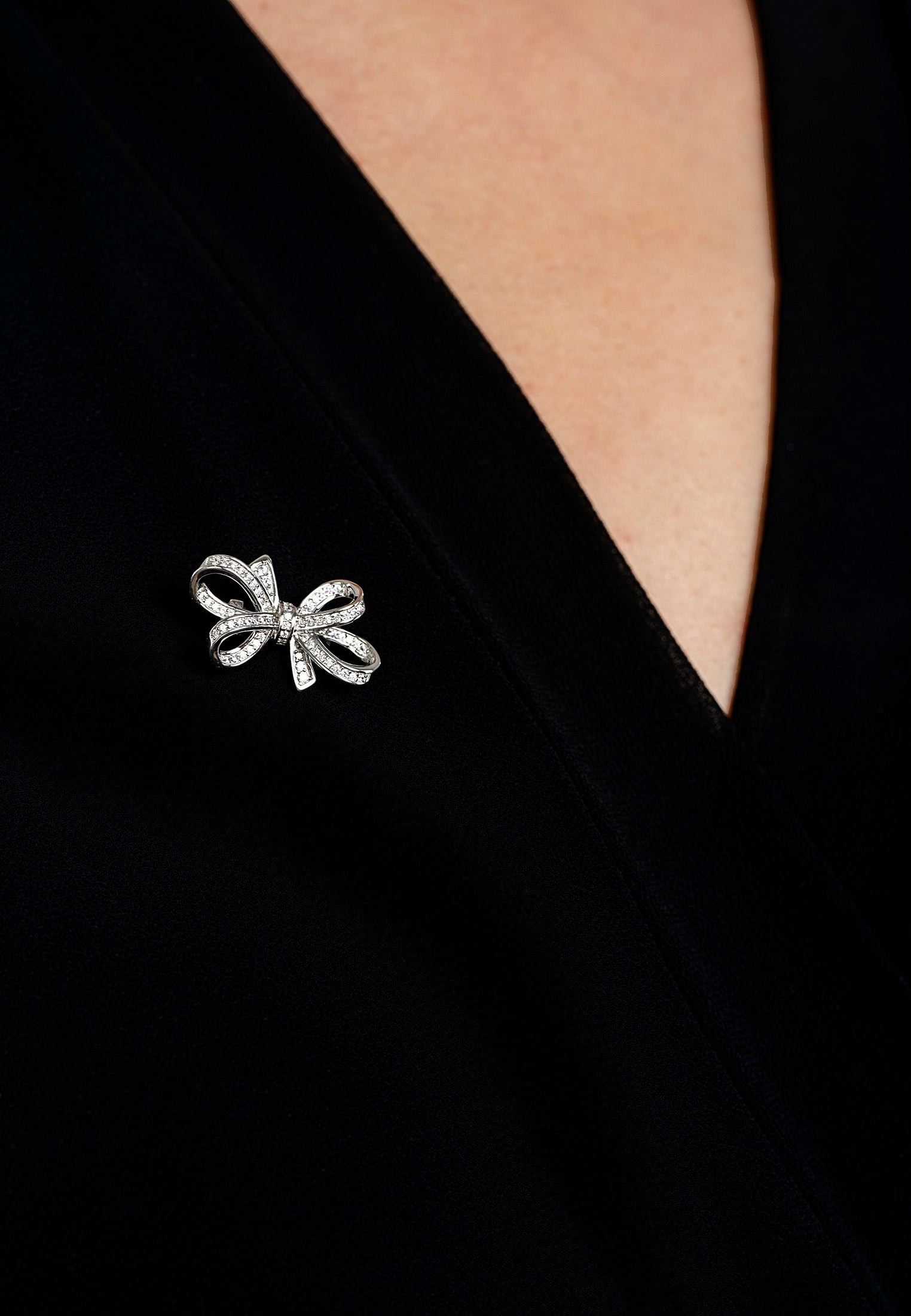 The brooch worn by a model.