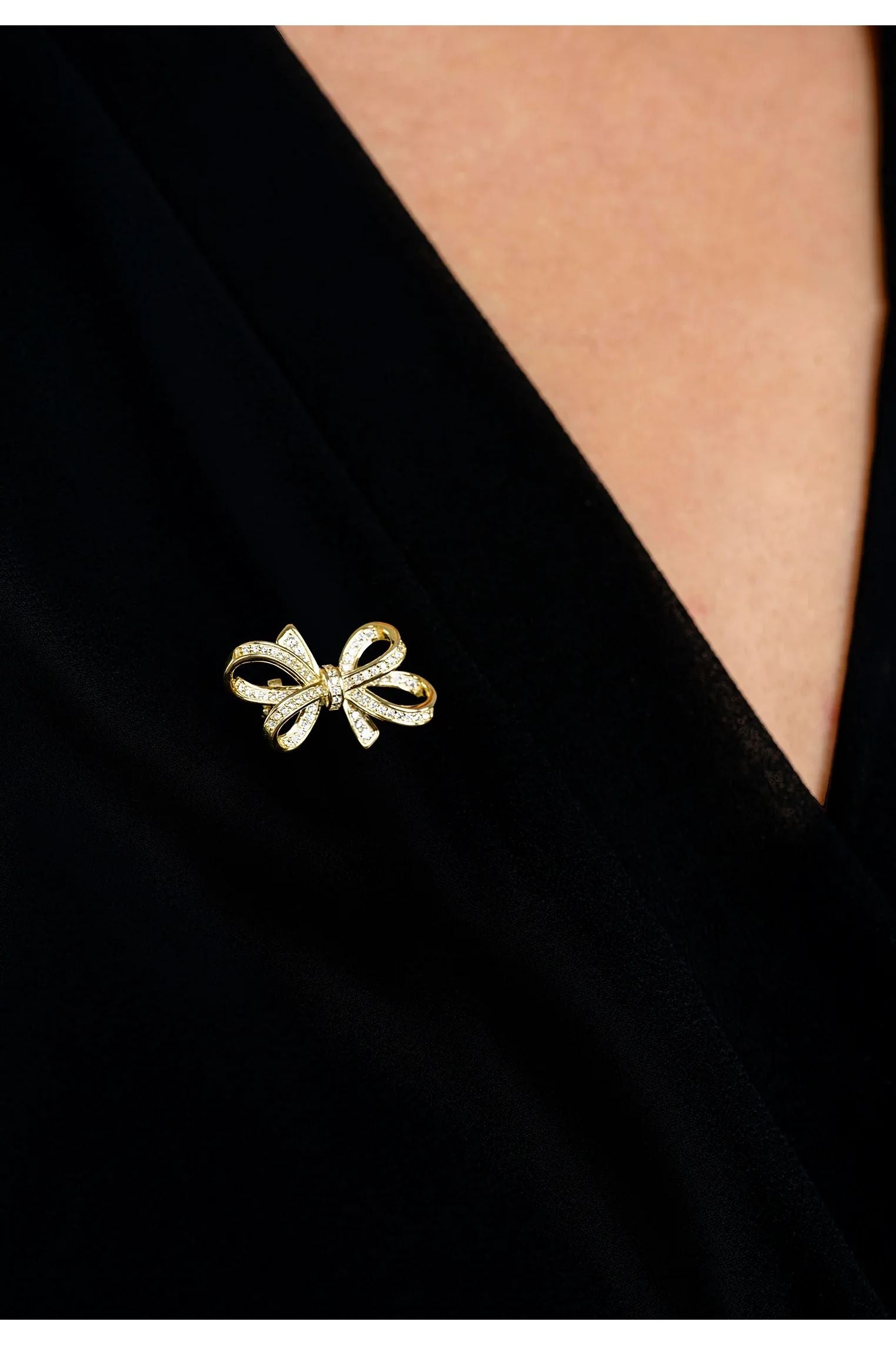 The brooch worn by a model.