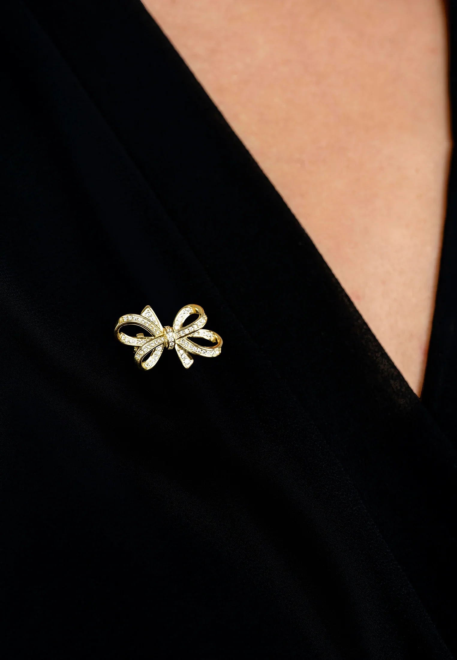 The brooch worn by a model.