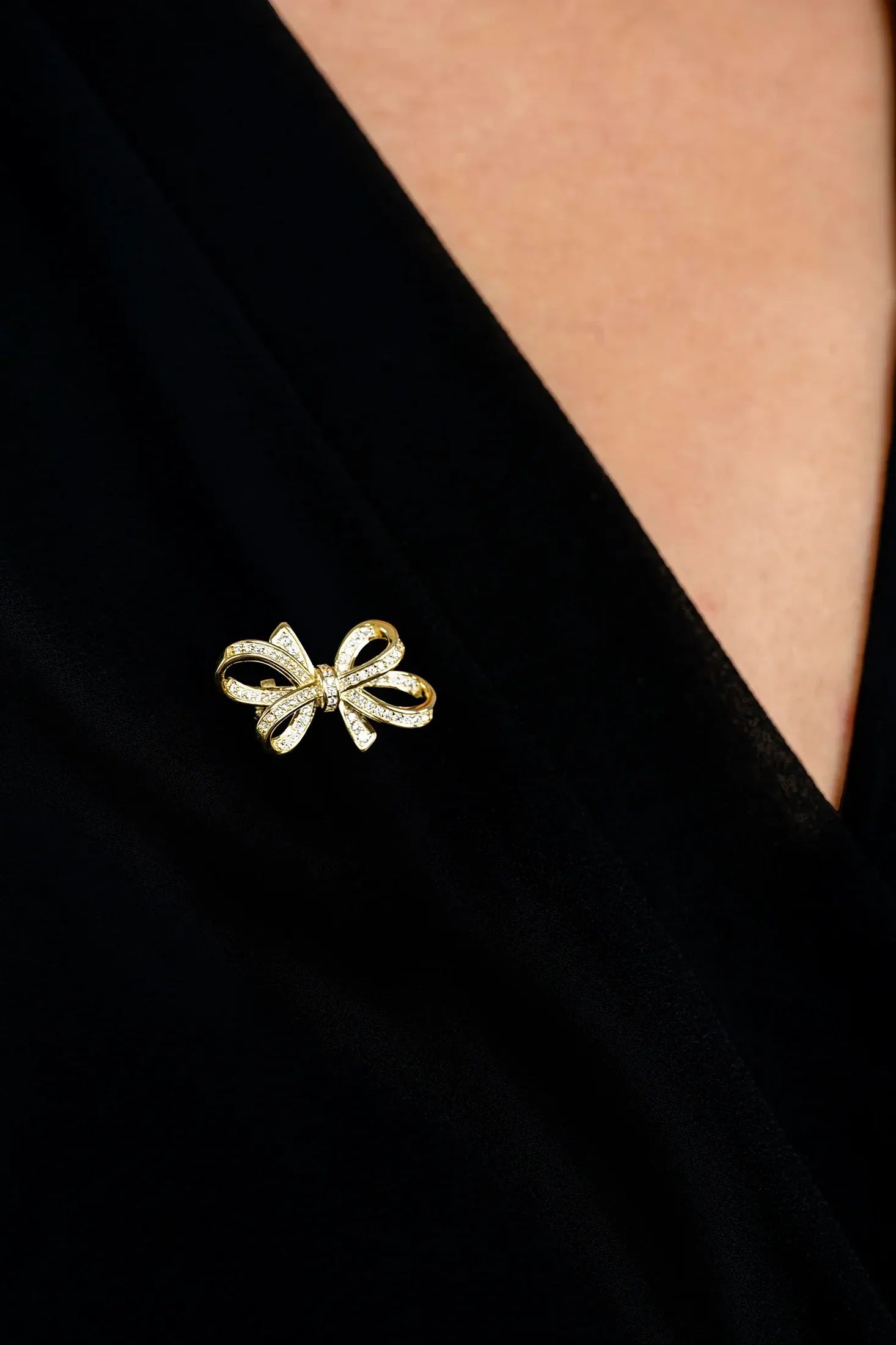 The brooch worn by a model.