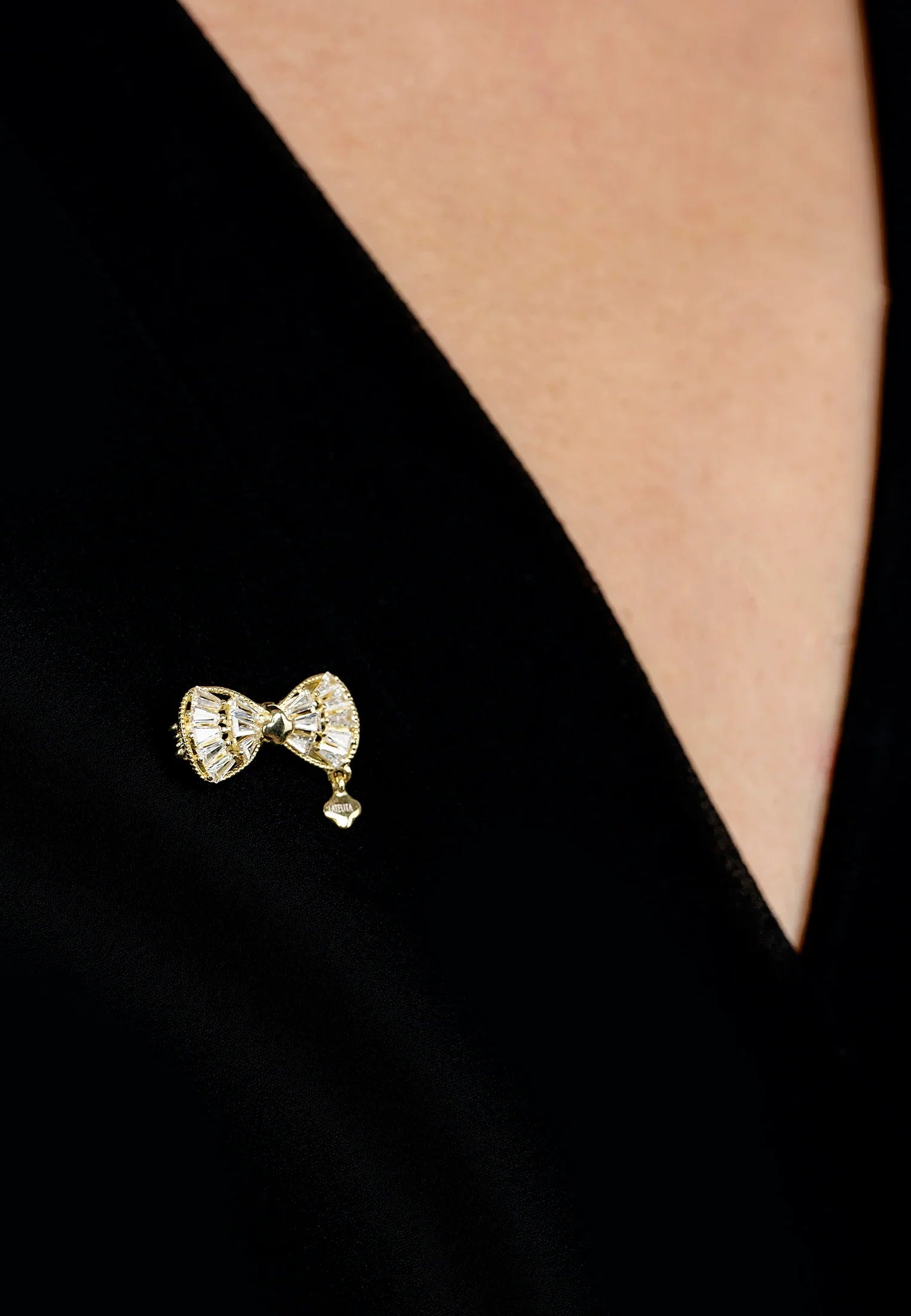 The brooch worn by a model.