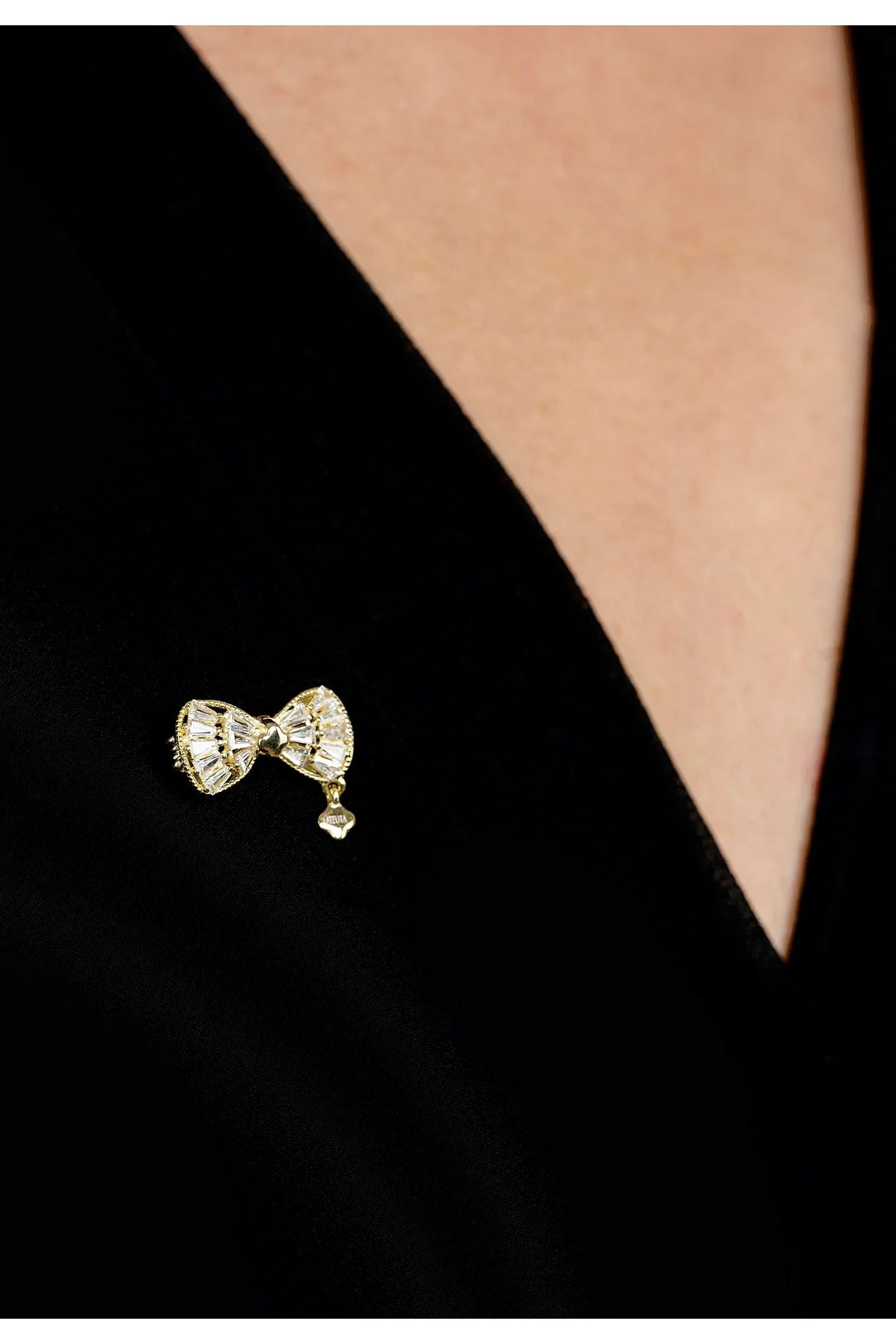 The brooch worn by a model.