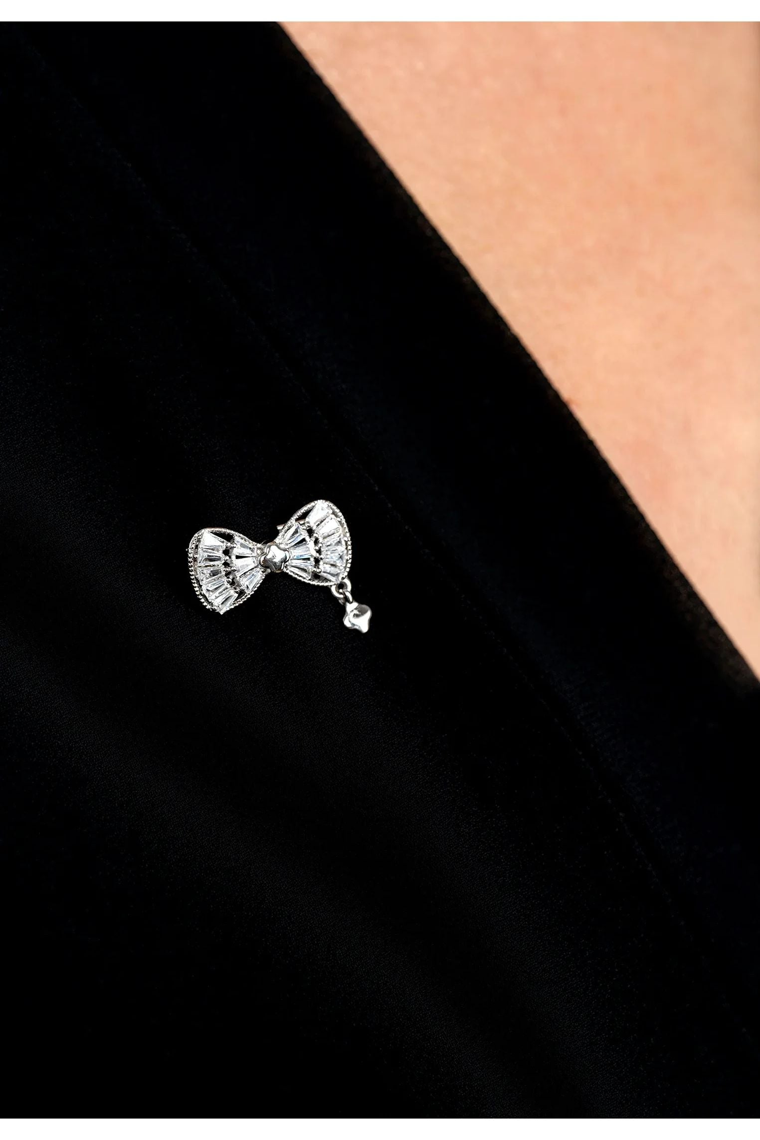 The brooch worn by a model.