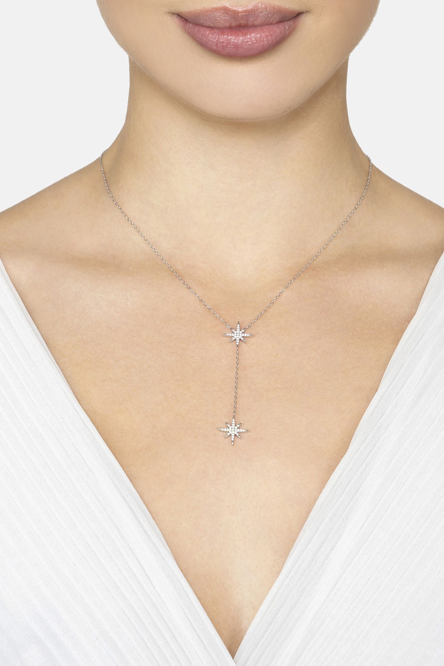 Necklace with star-shaped pendants on a white background