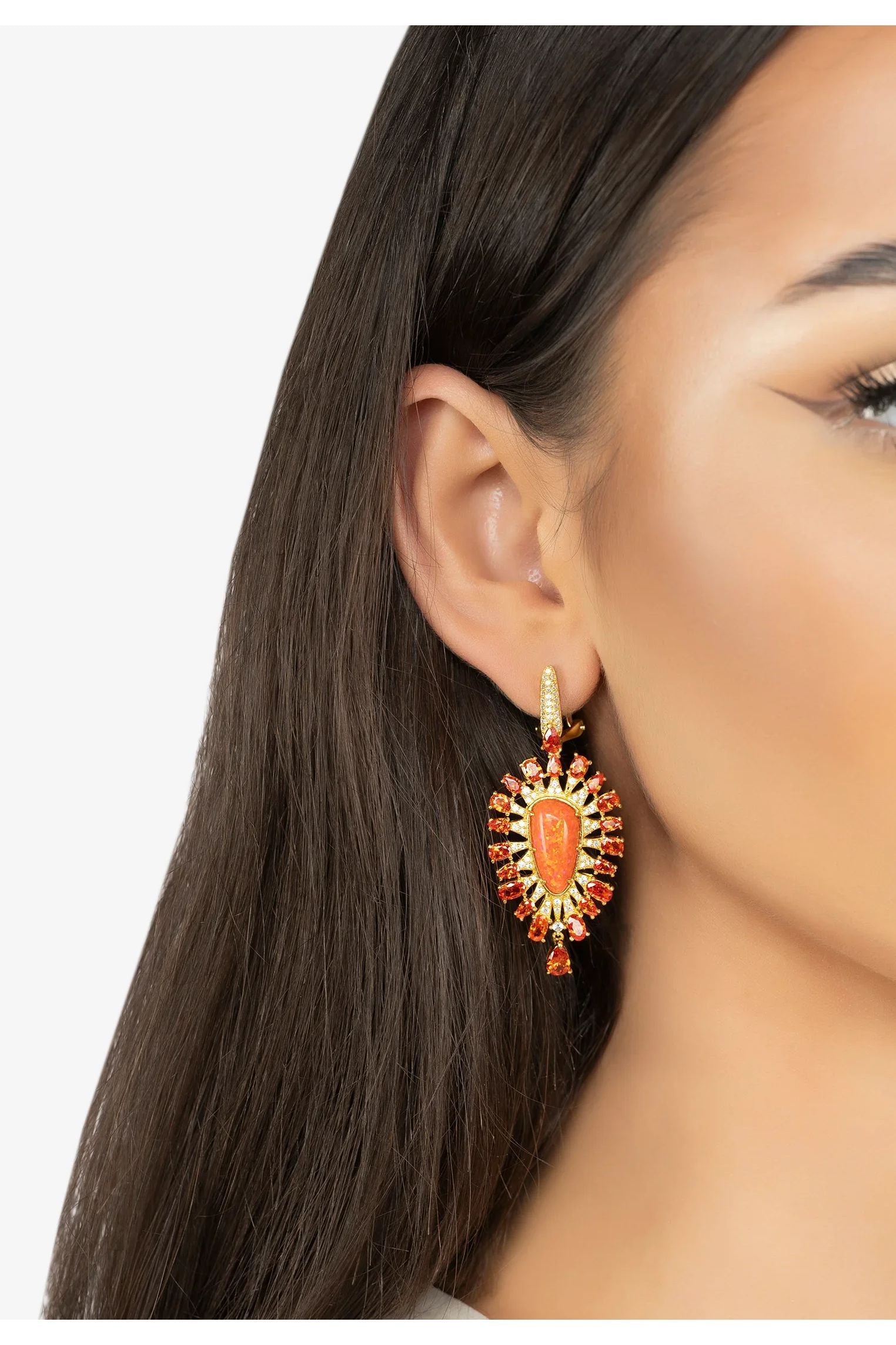 The earring worn by a model.