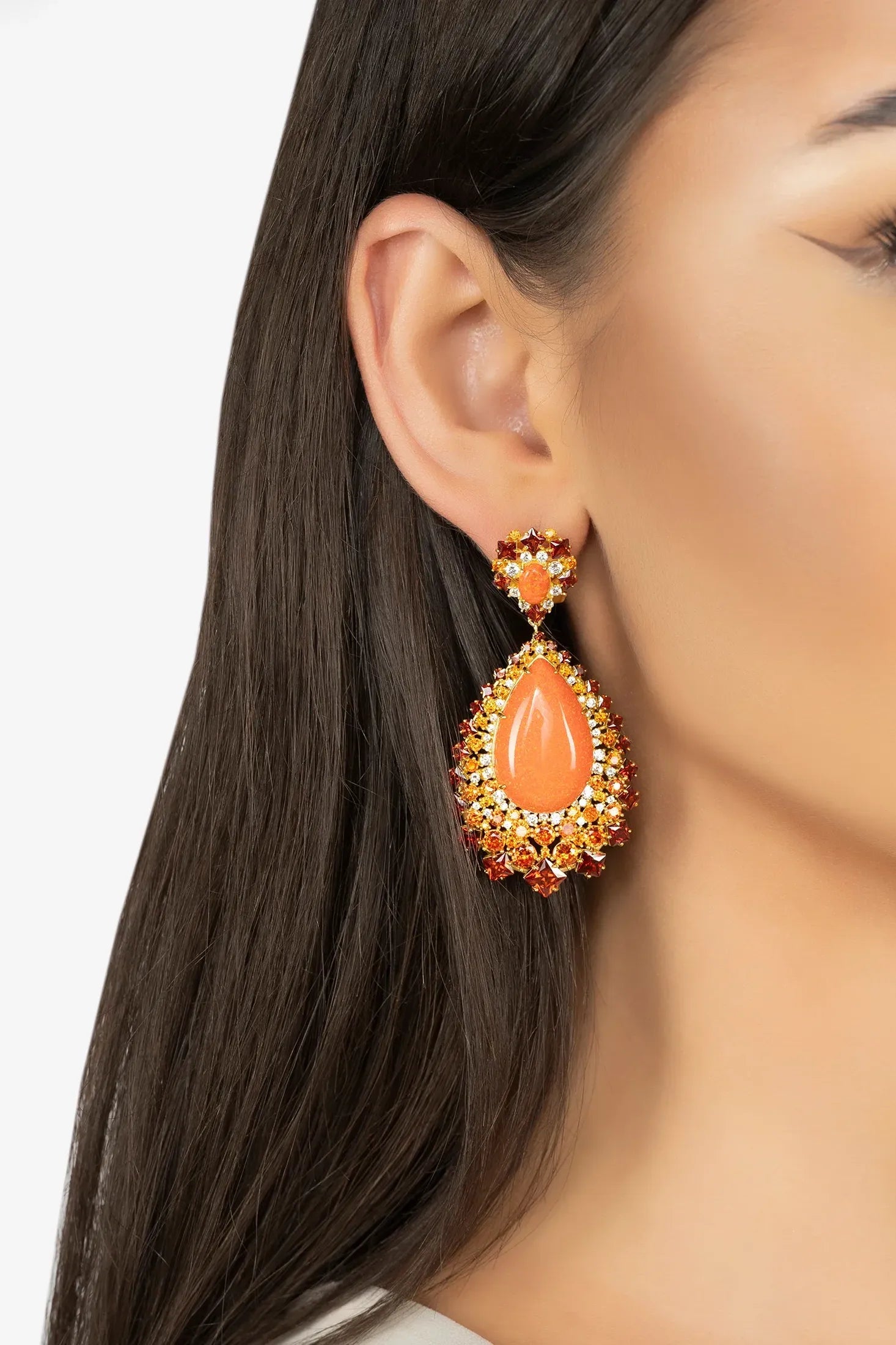 The earring worn by a model.