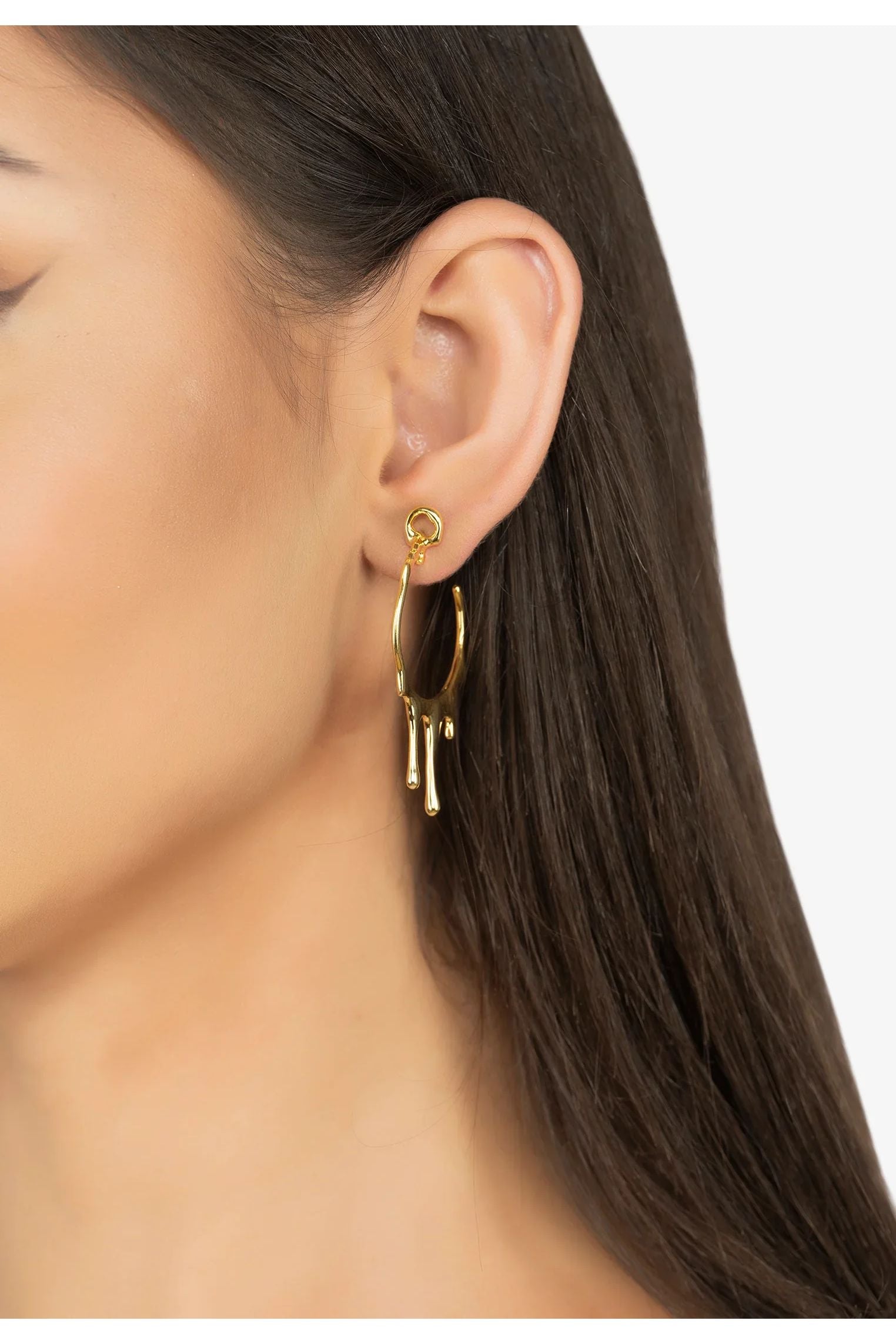 The earring worn by a model.