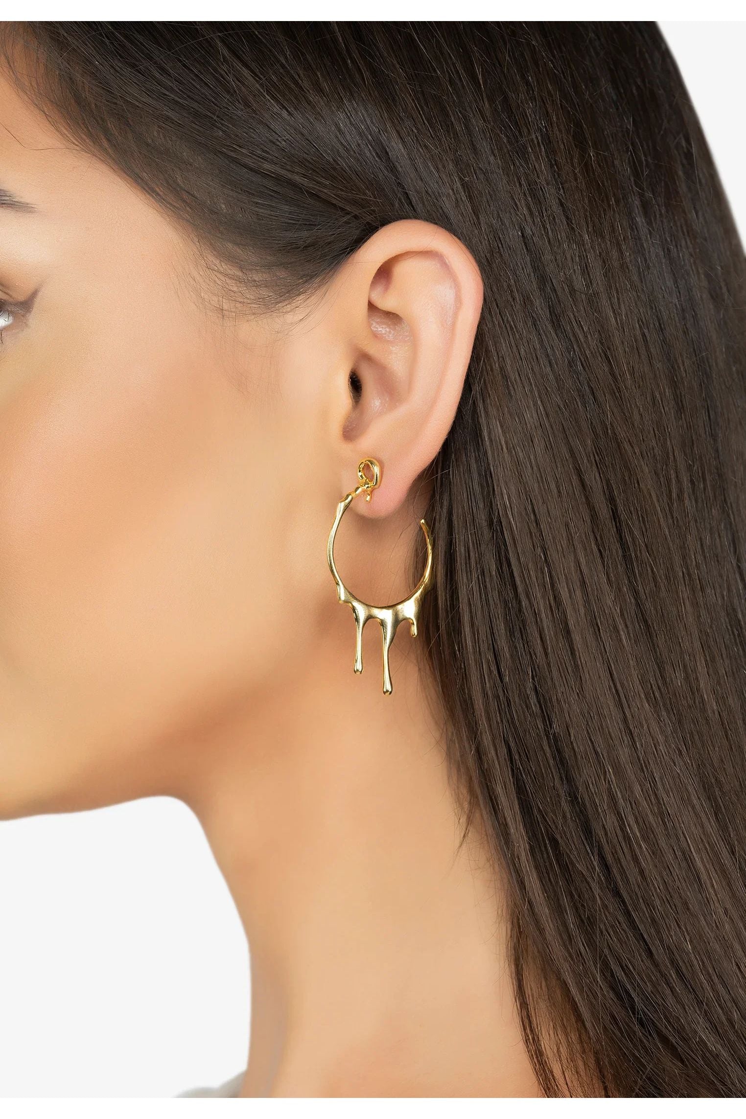 The earring worn by a model.