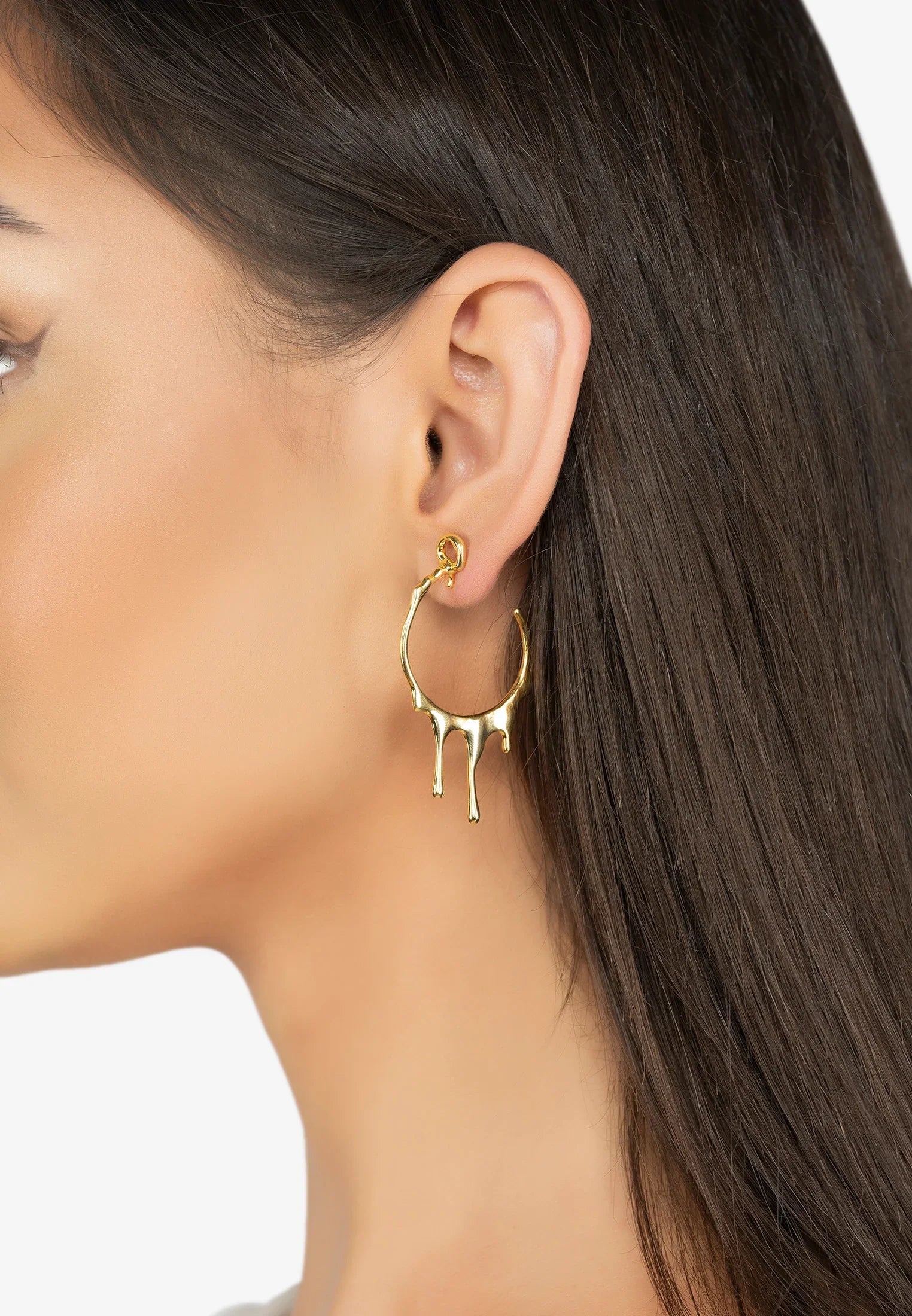 The earring worn by a model.