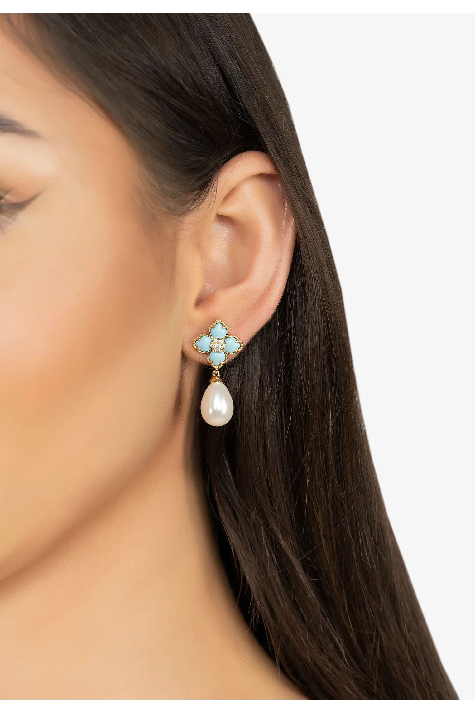 The earring worn by a model.