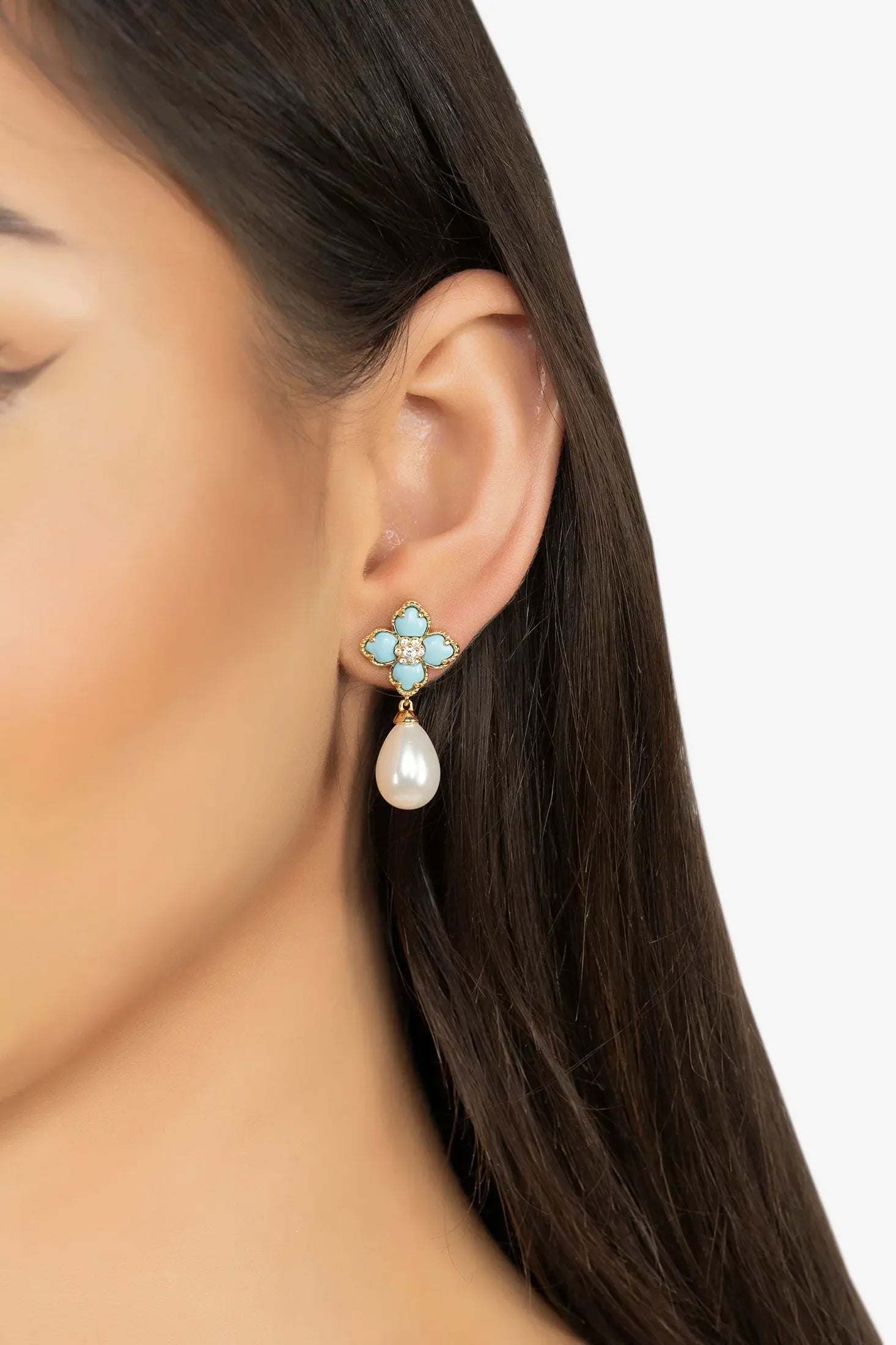 The earring worn by a model.