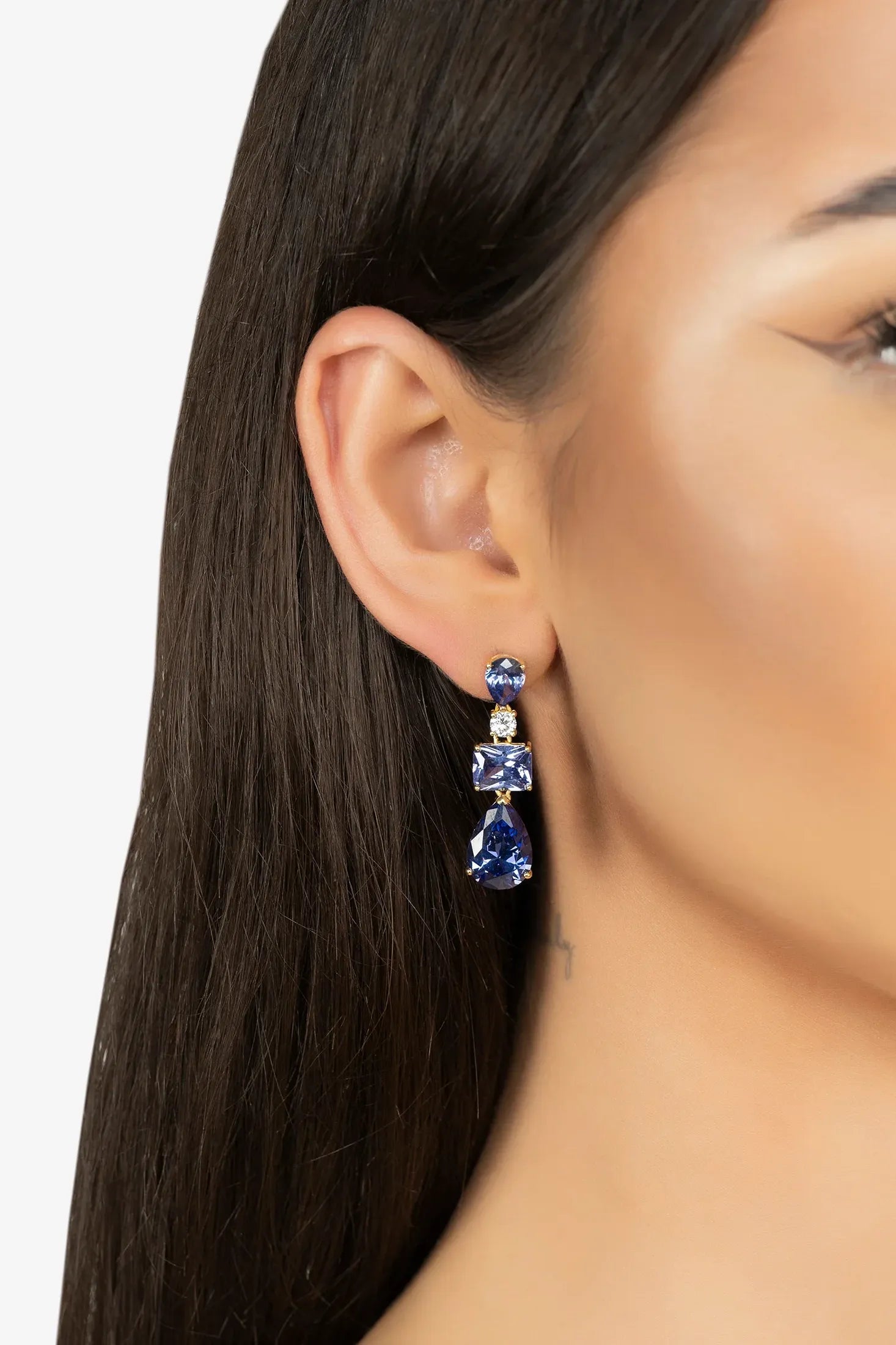 The earring worn by a model.