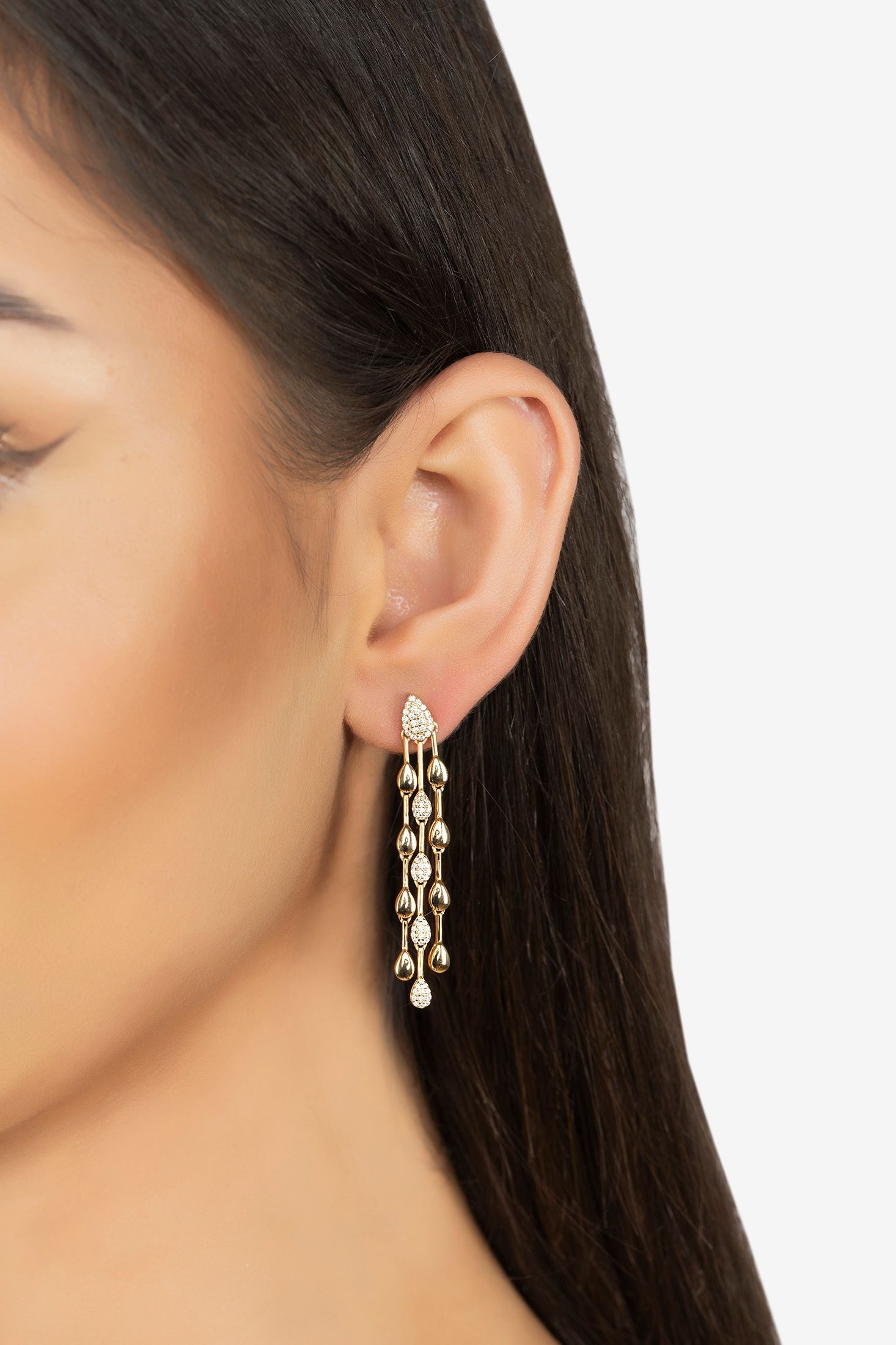 The earring worn by a model.