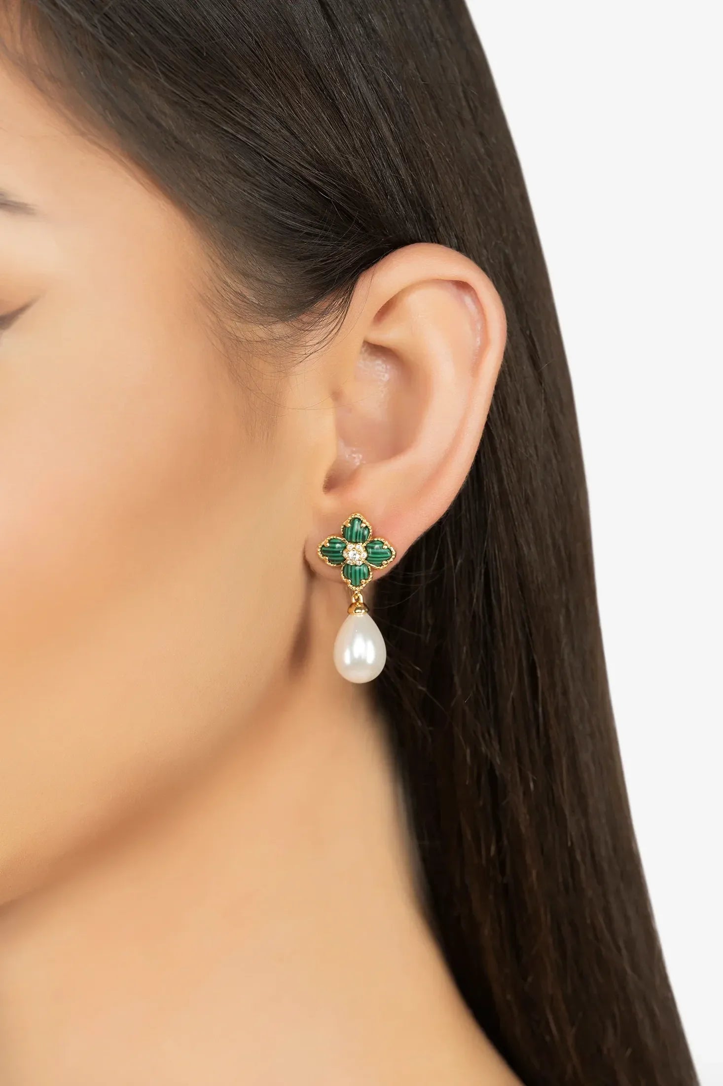 The earring worn by a model.
