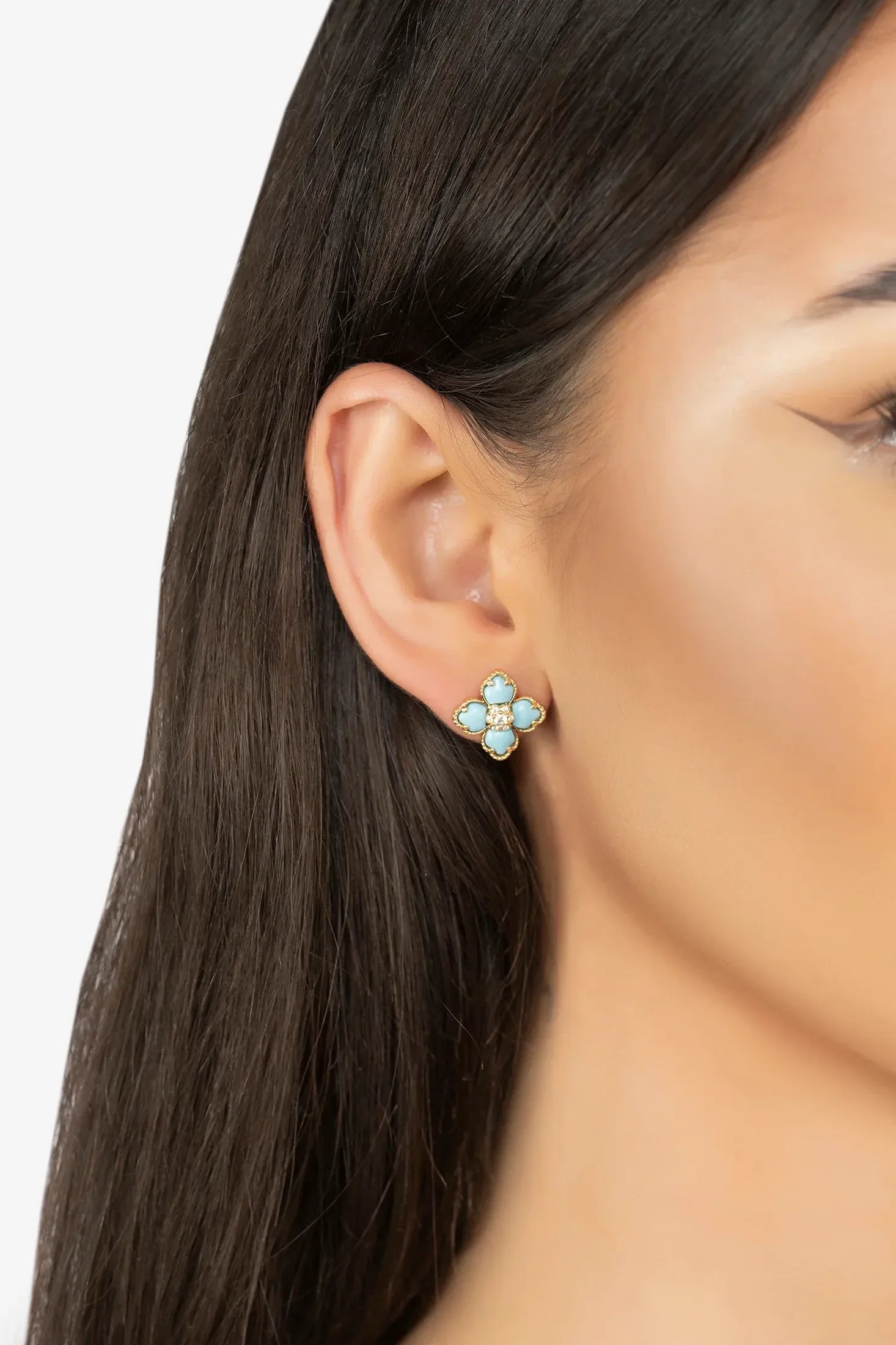 The earring worn by a model.