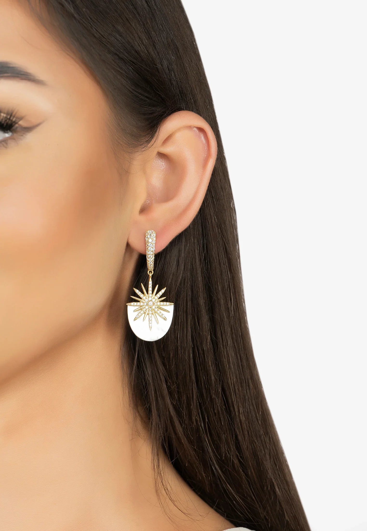 The earring worn by a model.