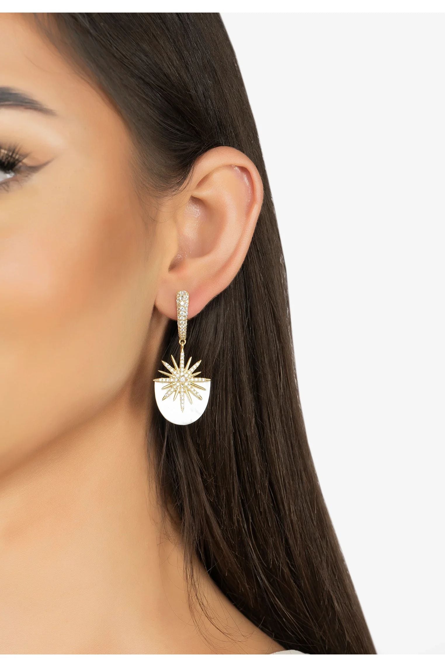 The earring worn by a model.