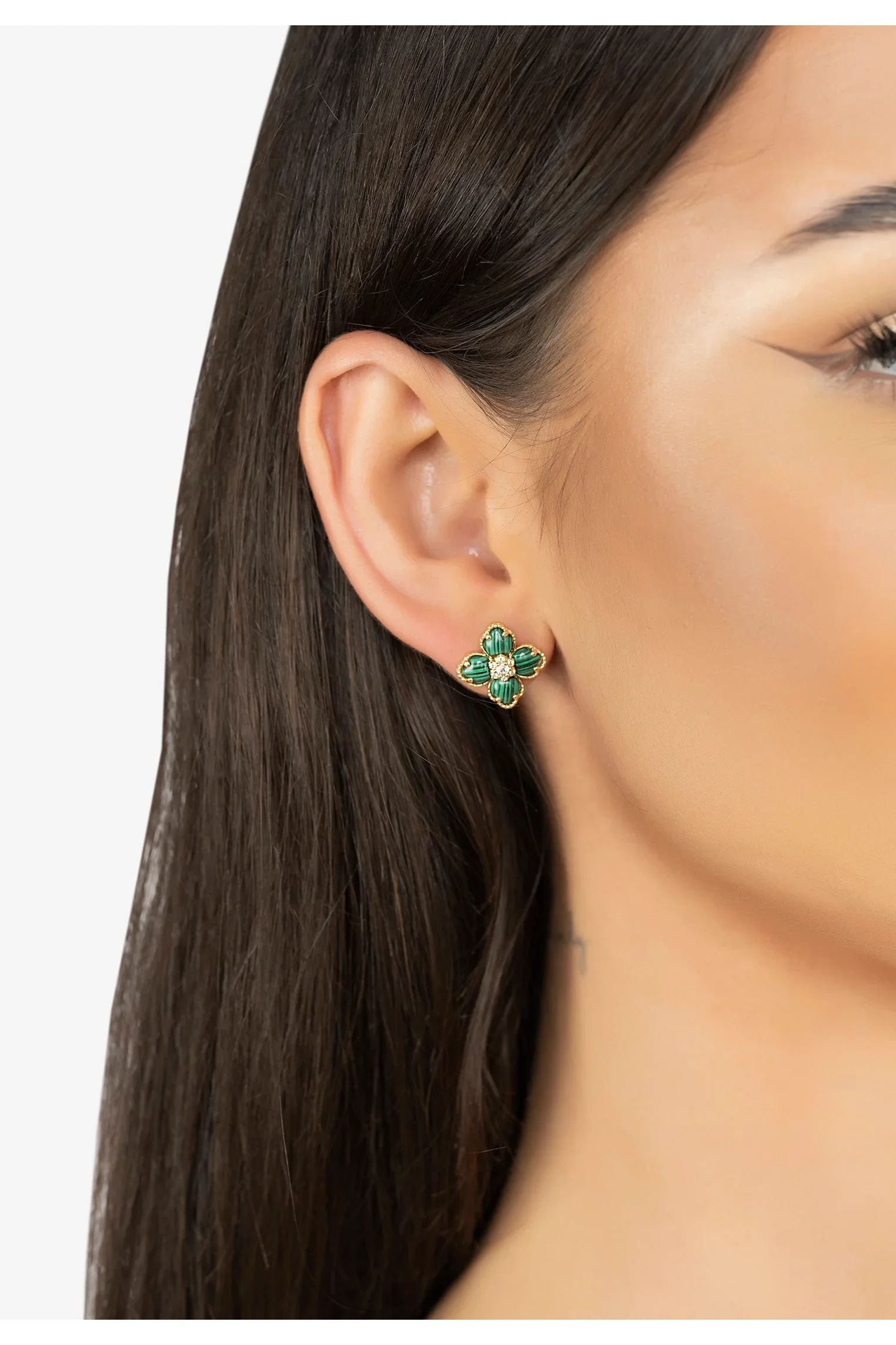 The earring worn by a model.