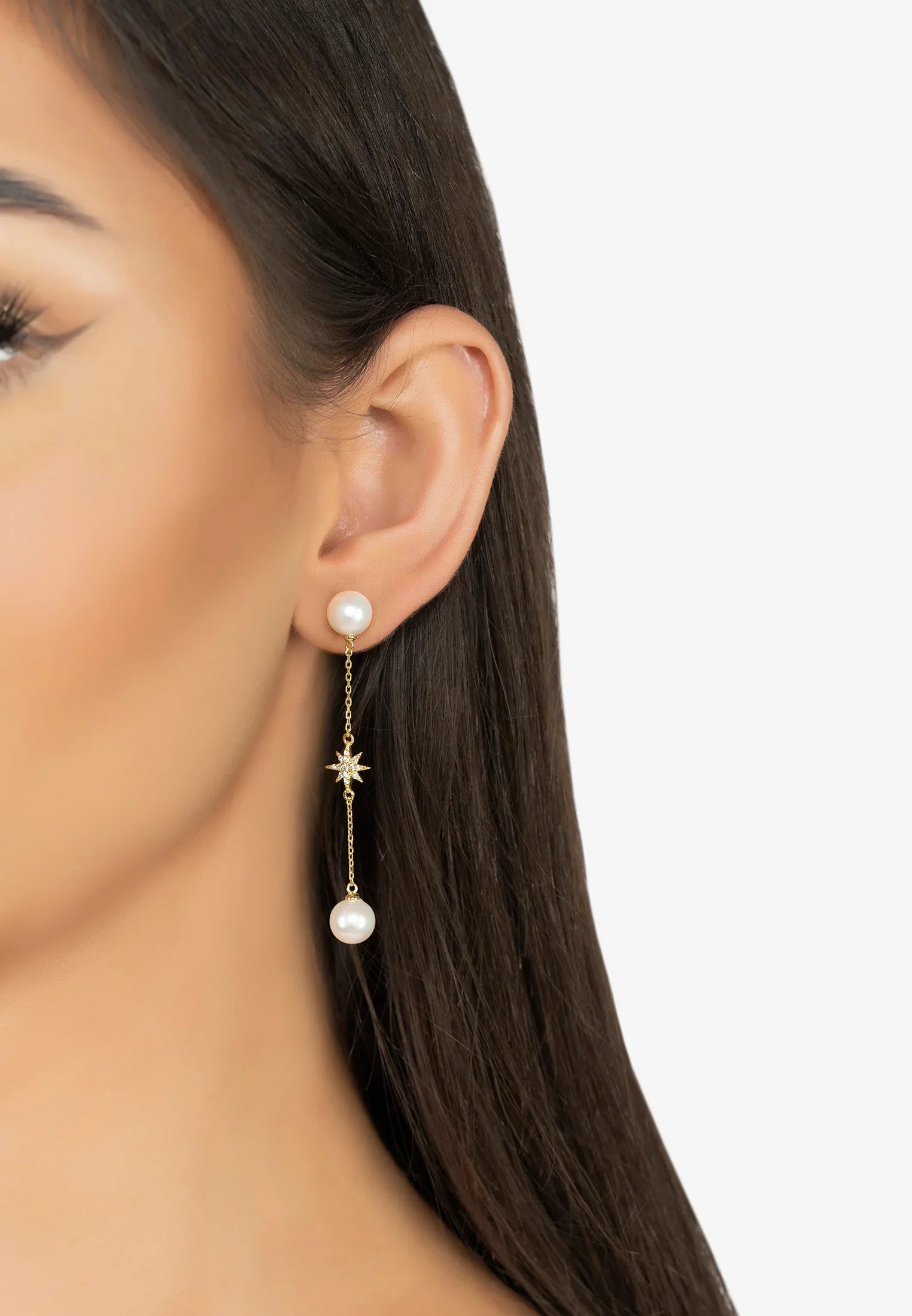 The earring worn by a model.