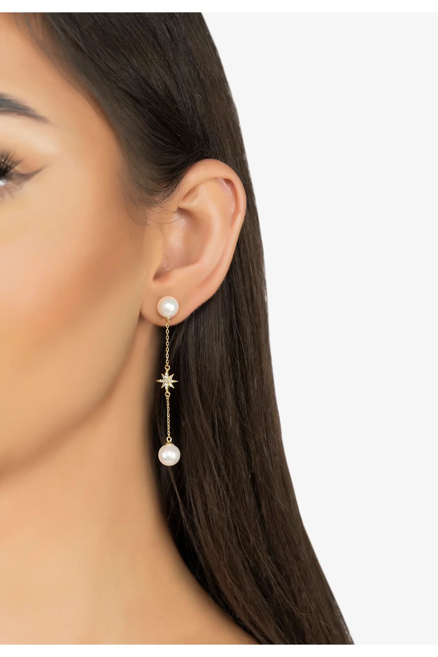 The earring worn by a model.