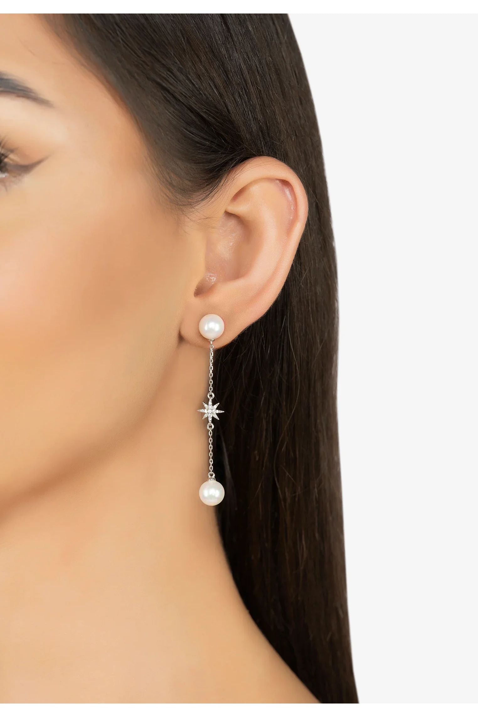 The earring worn by a model.