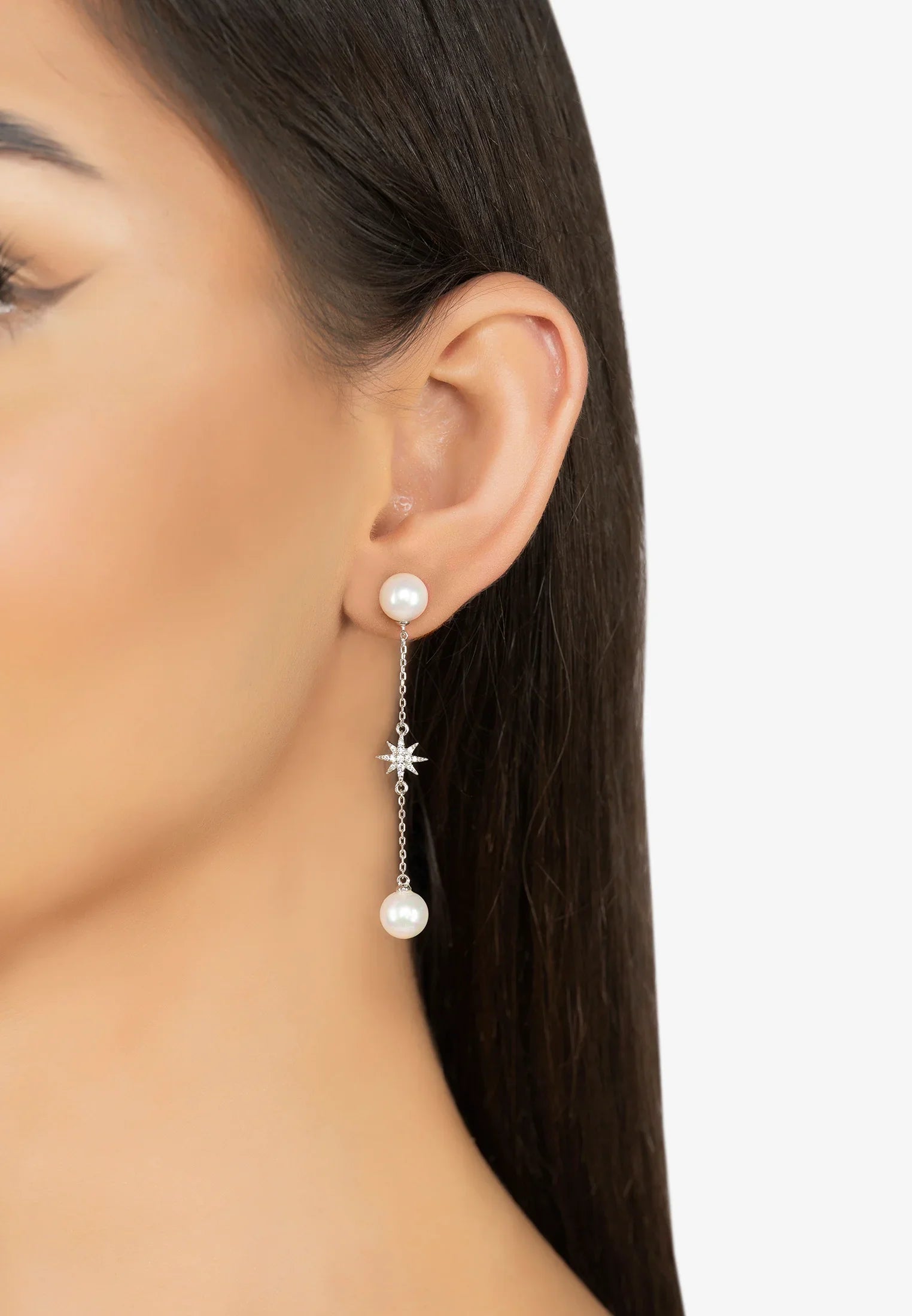 The earring worn by a model.