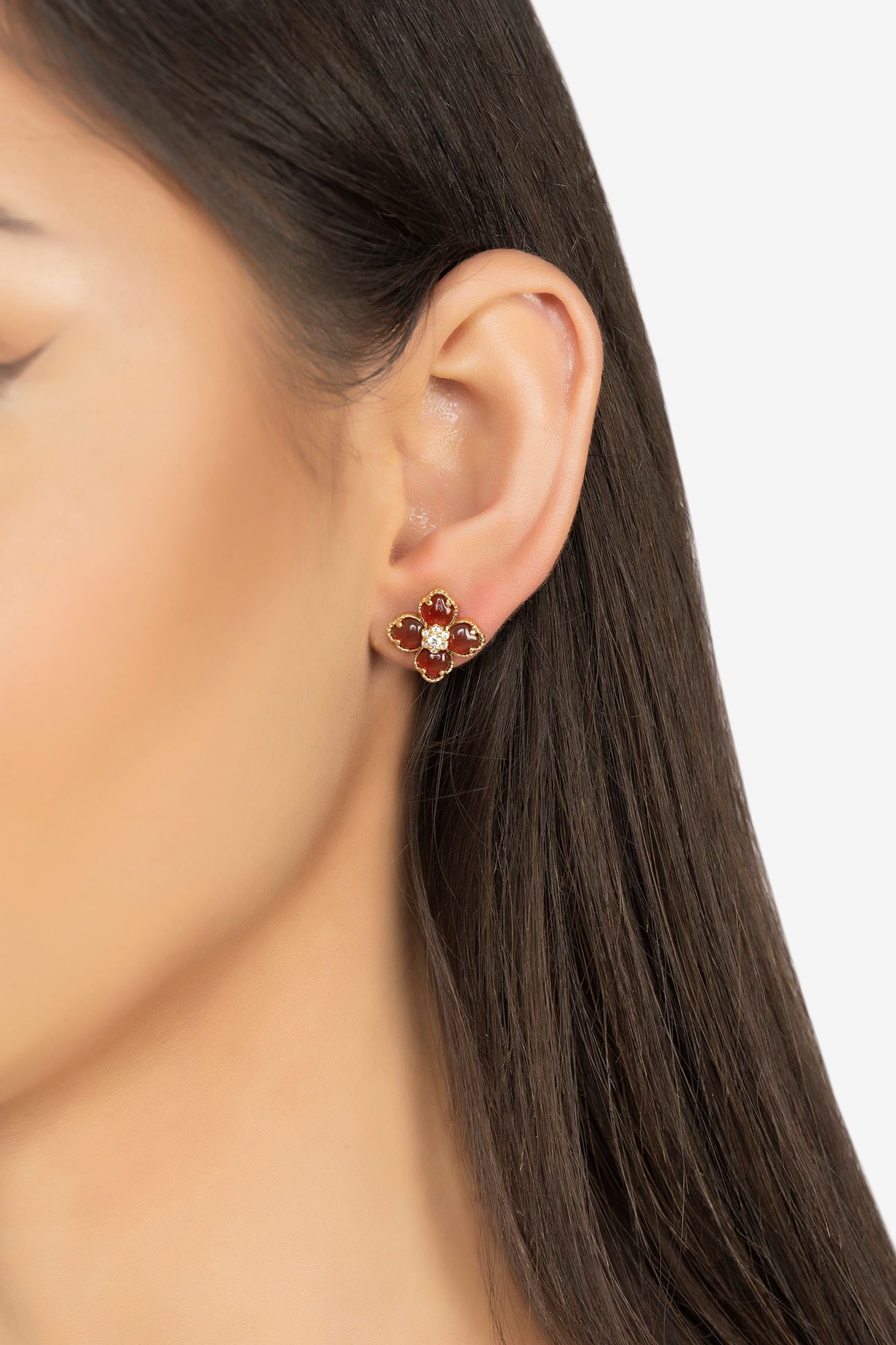 The earring worn by a model.