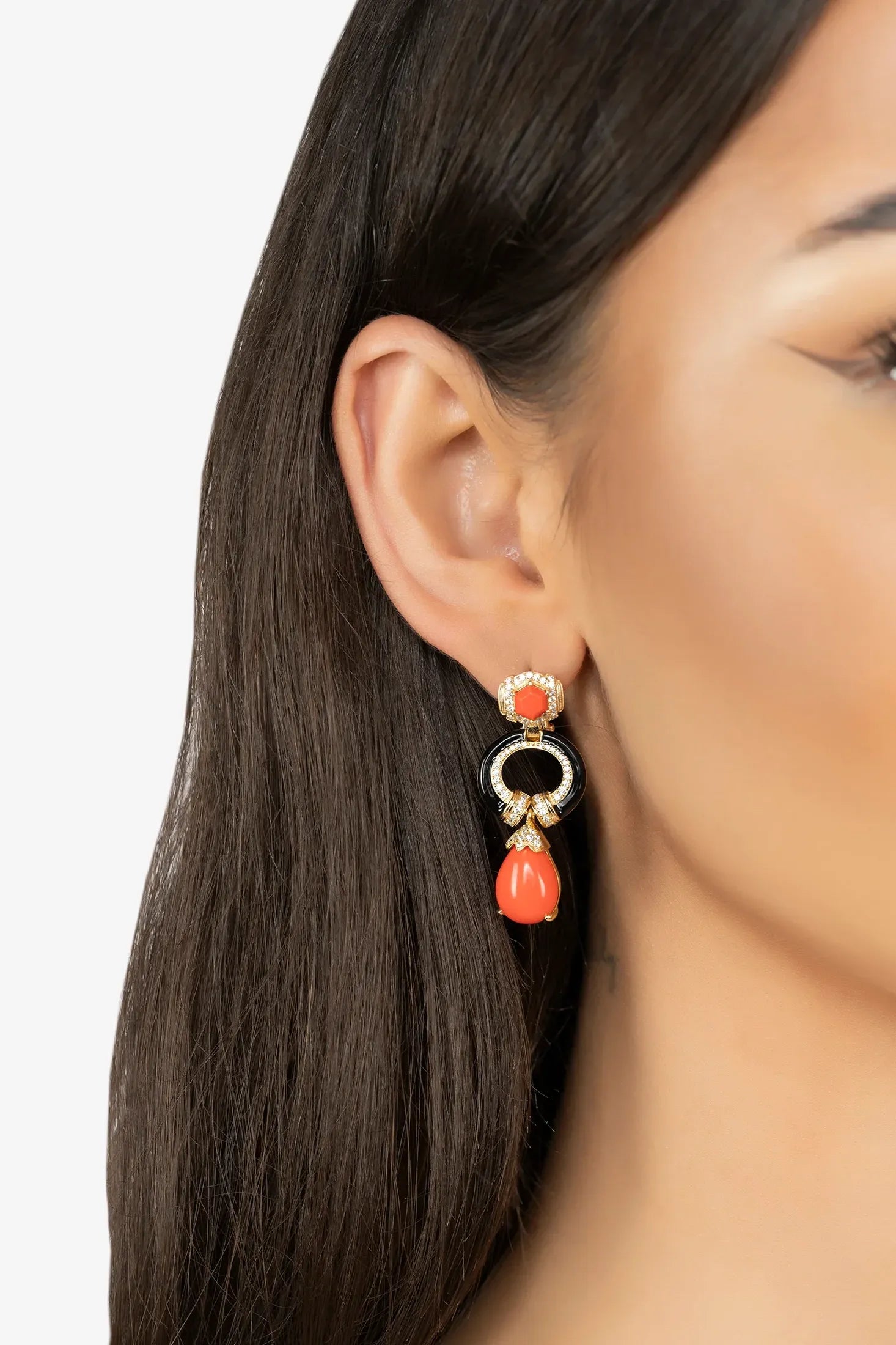 The earring worn by a model.