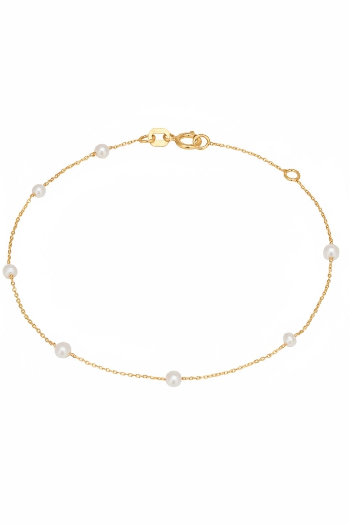 Gold bracelet with pearls on a white background