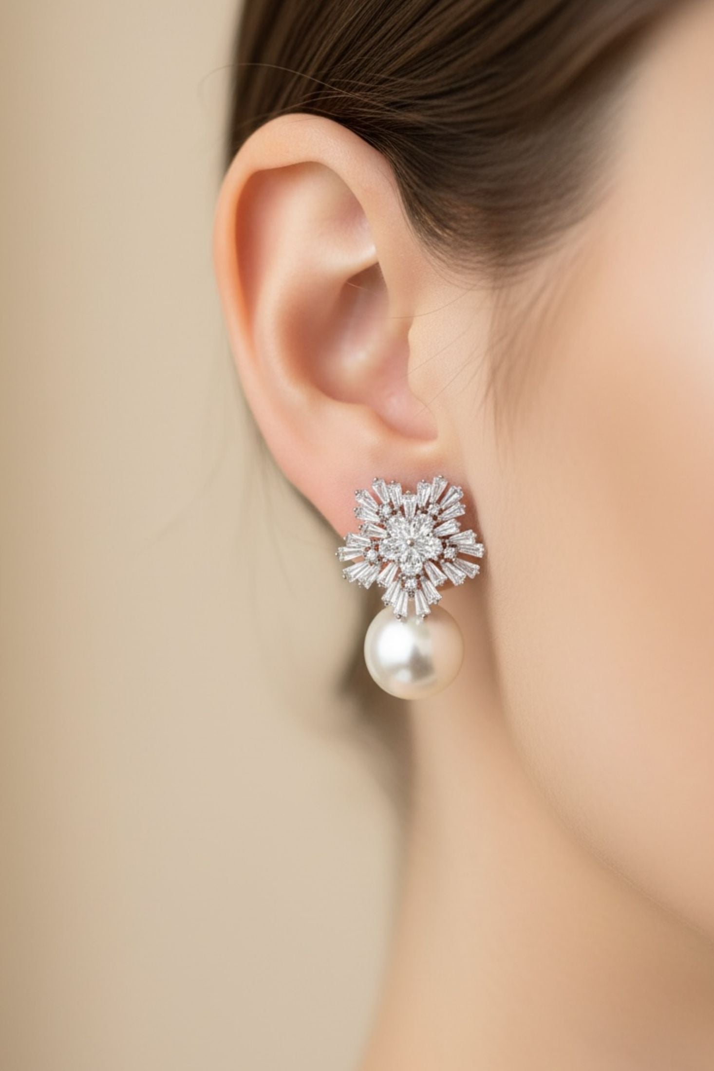 Close-up of the earring worn by a model.