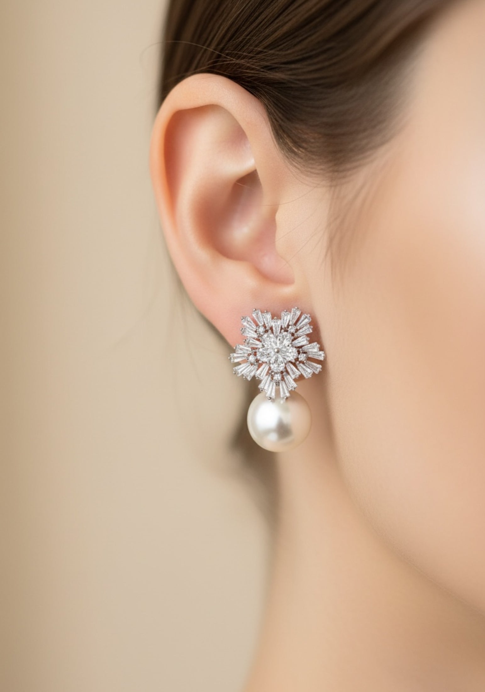 Close-up of the earring worn by a model.