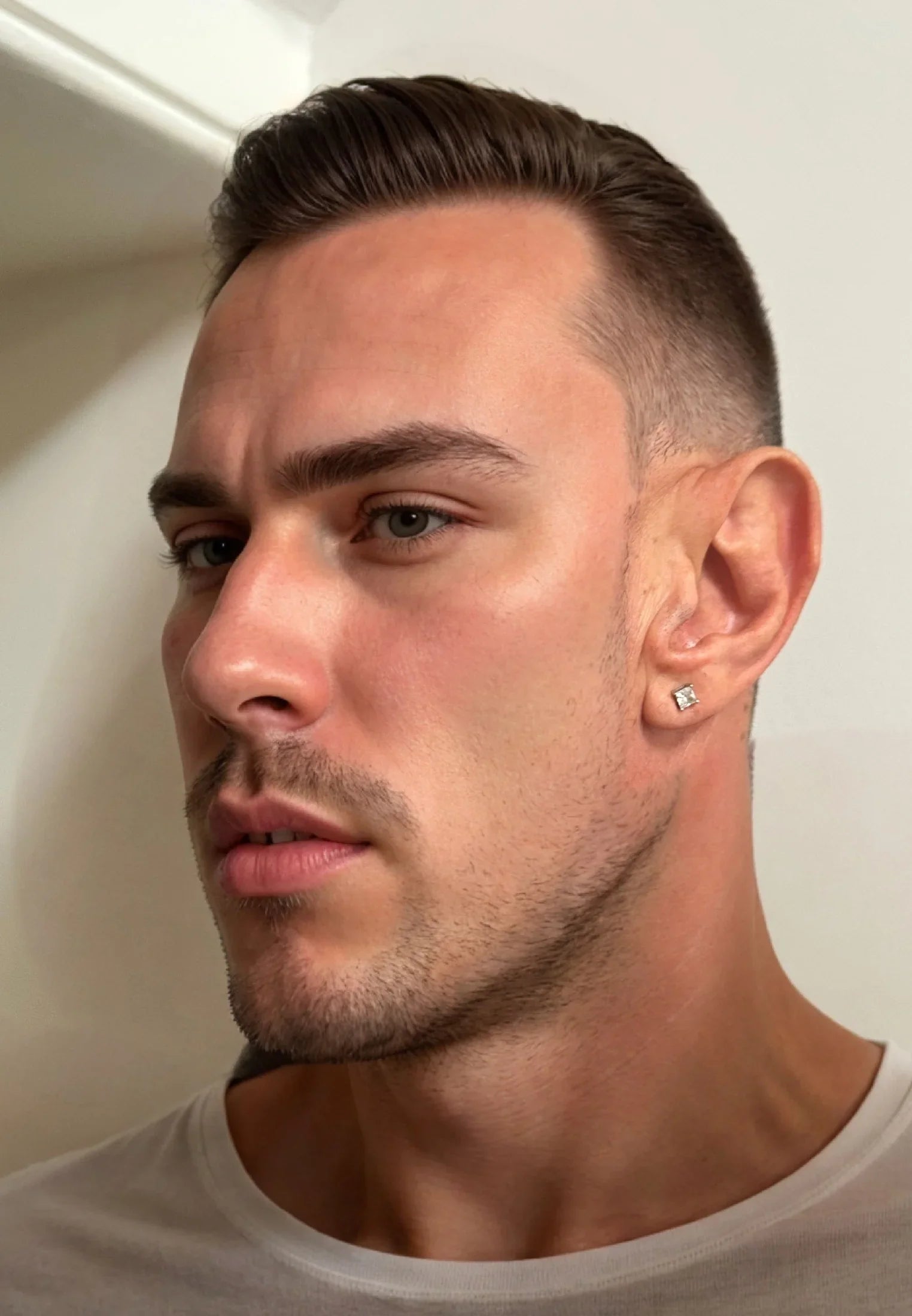 The earring worn by a model.