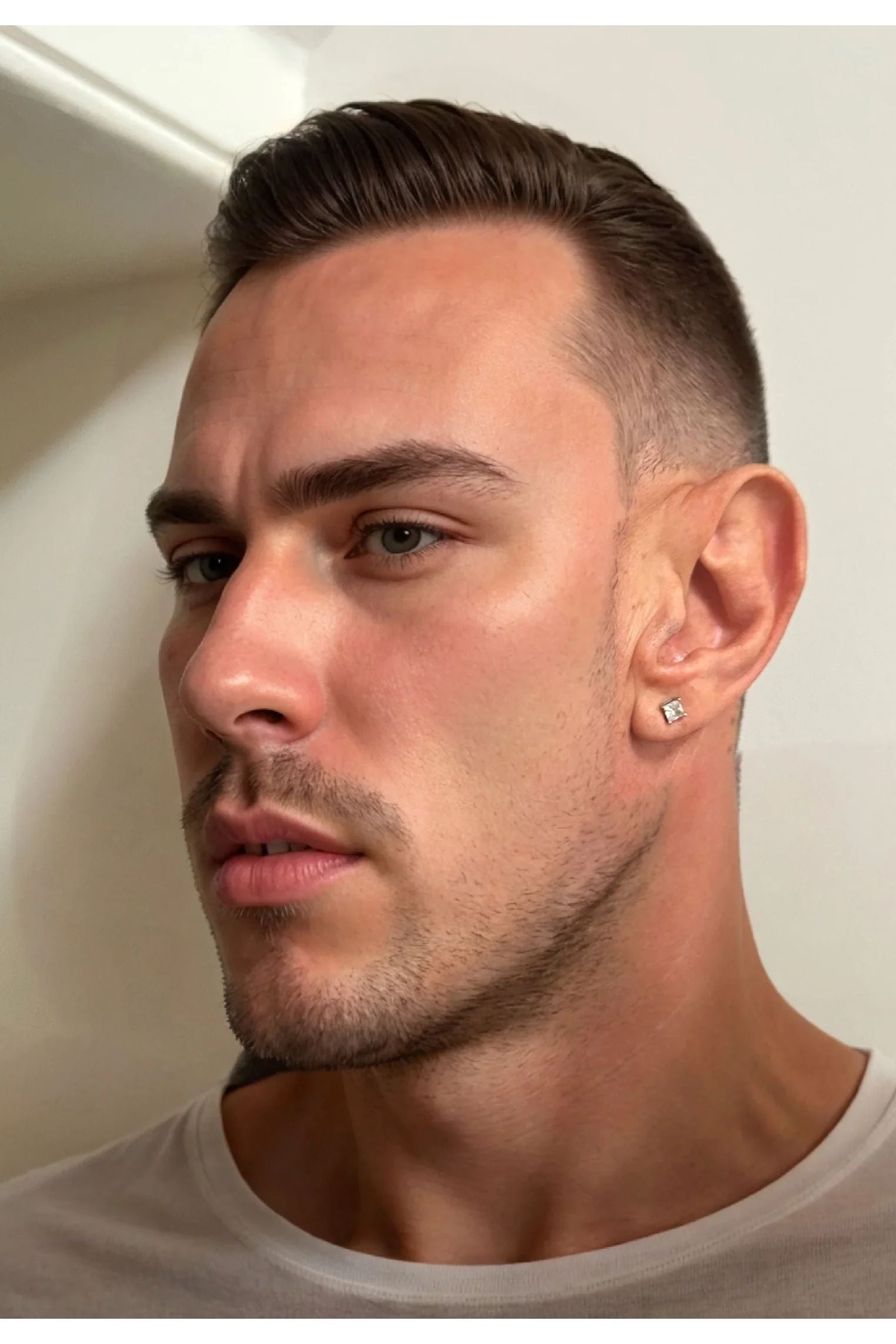 The earring worn by a model.