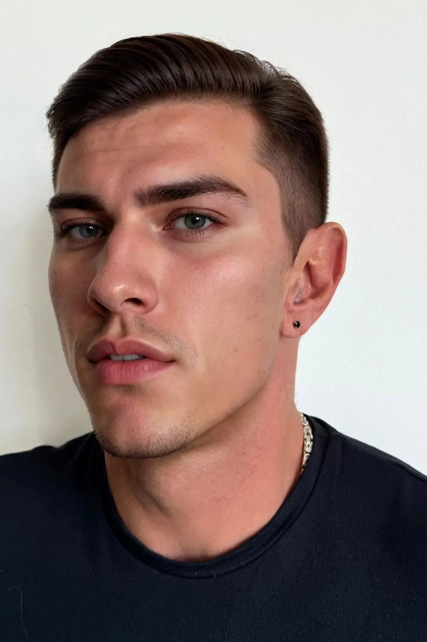 The earring worn by a model.