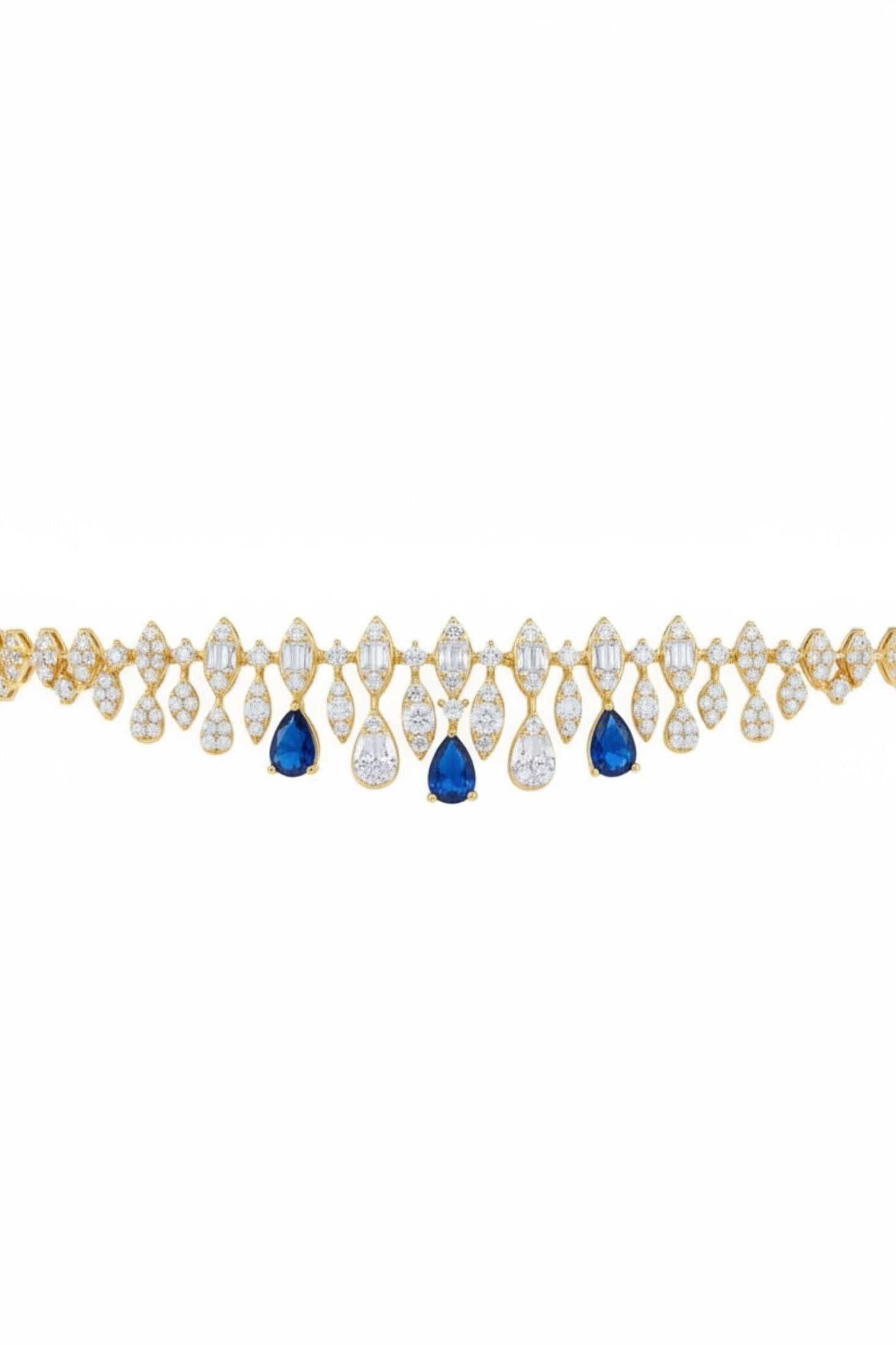 Gold necklace with teardrop-shaped blue and clear gemstones on a white background