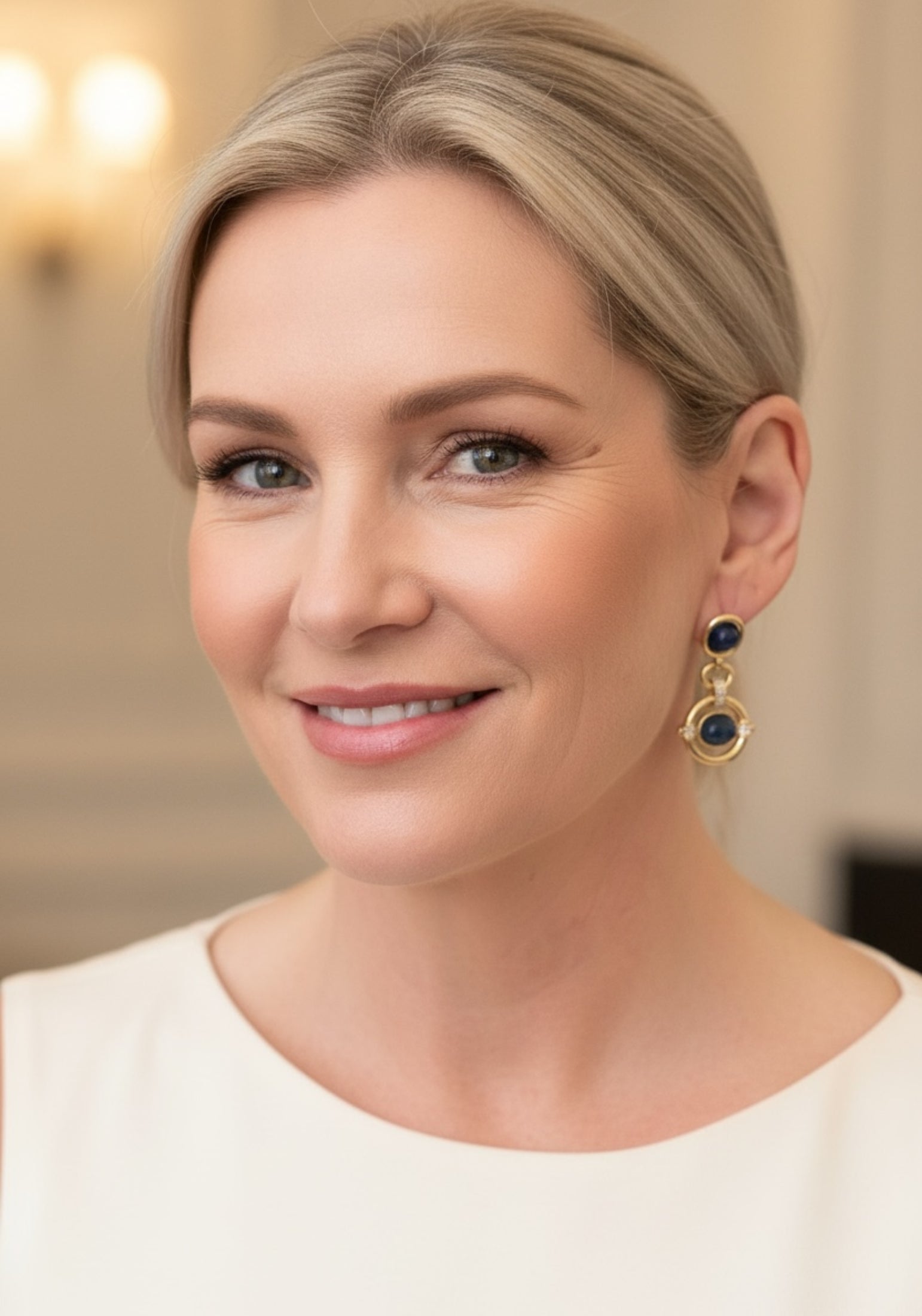 Woman wearing earrings with a blurred background