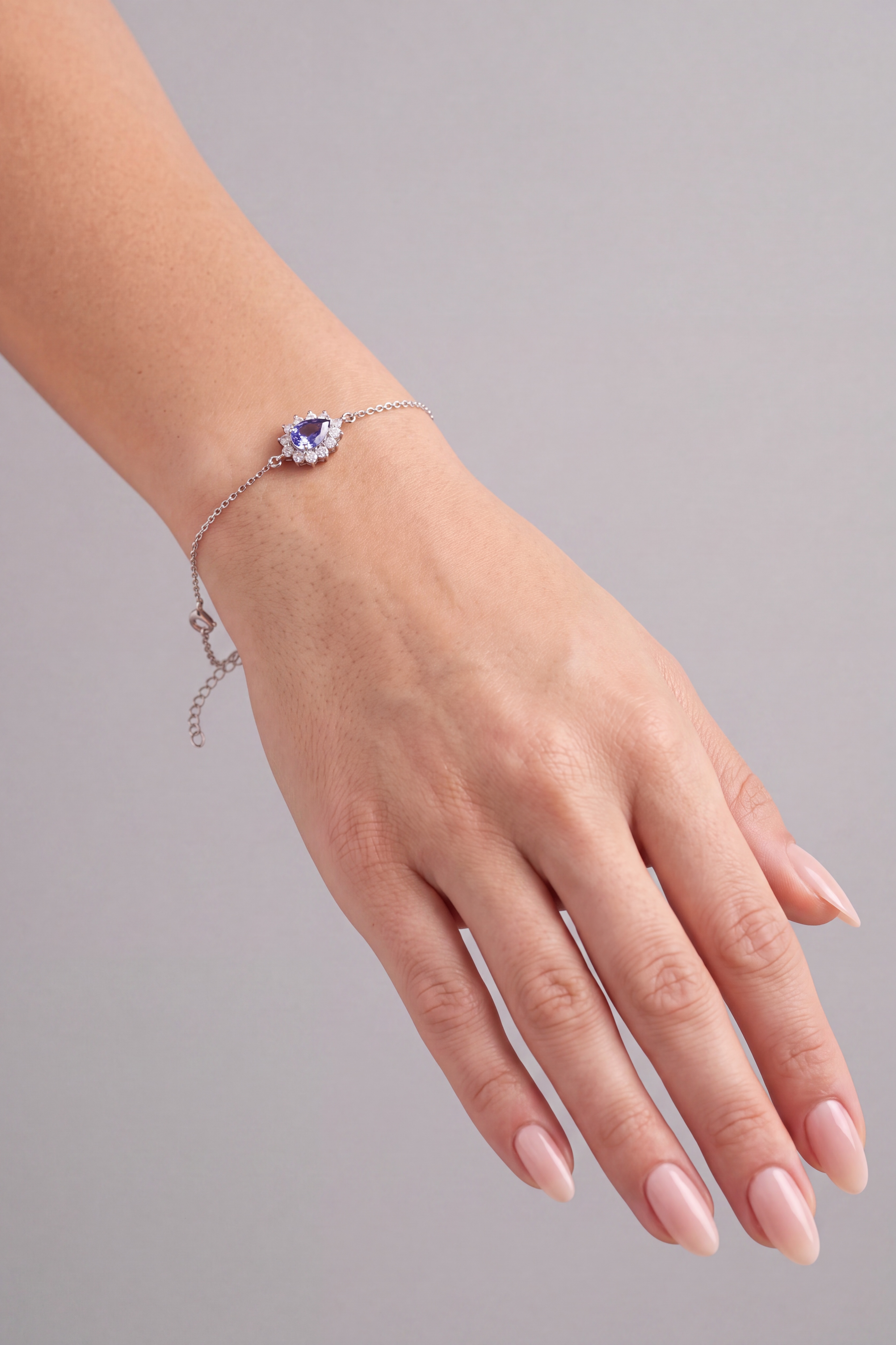 Angled view of Phillippa Bracelet Tanzanite Silver, showing tanzanite detailing, silver finish and the jewellery profile.
