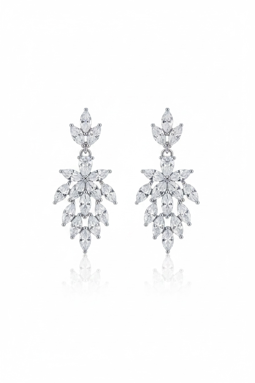 Pair of silver earrings with clear stones on a white background
