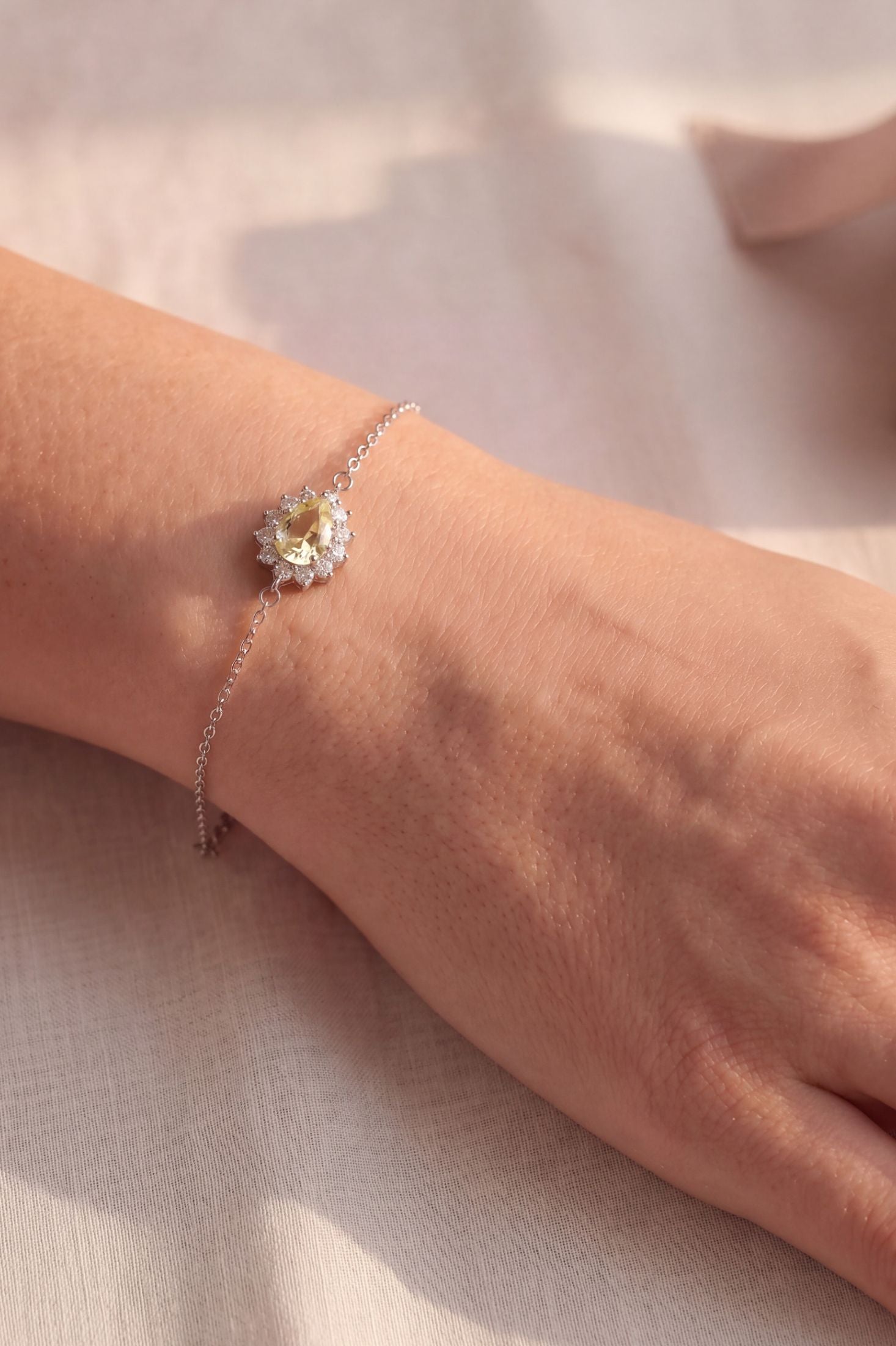 Angled view of Phillippa Bracelet Yellow Topaz Silver, showing silver finish and the jewellery profile.