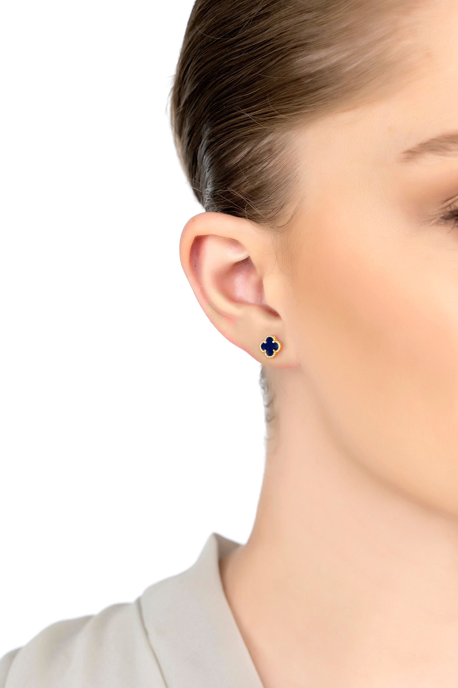 The earring worn by a model.