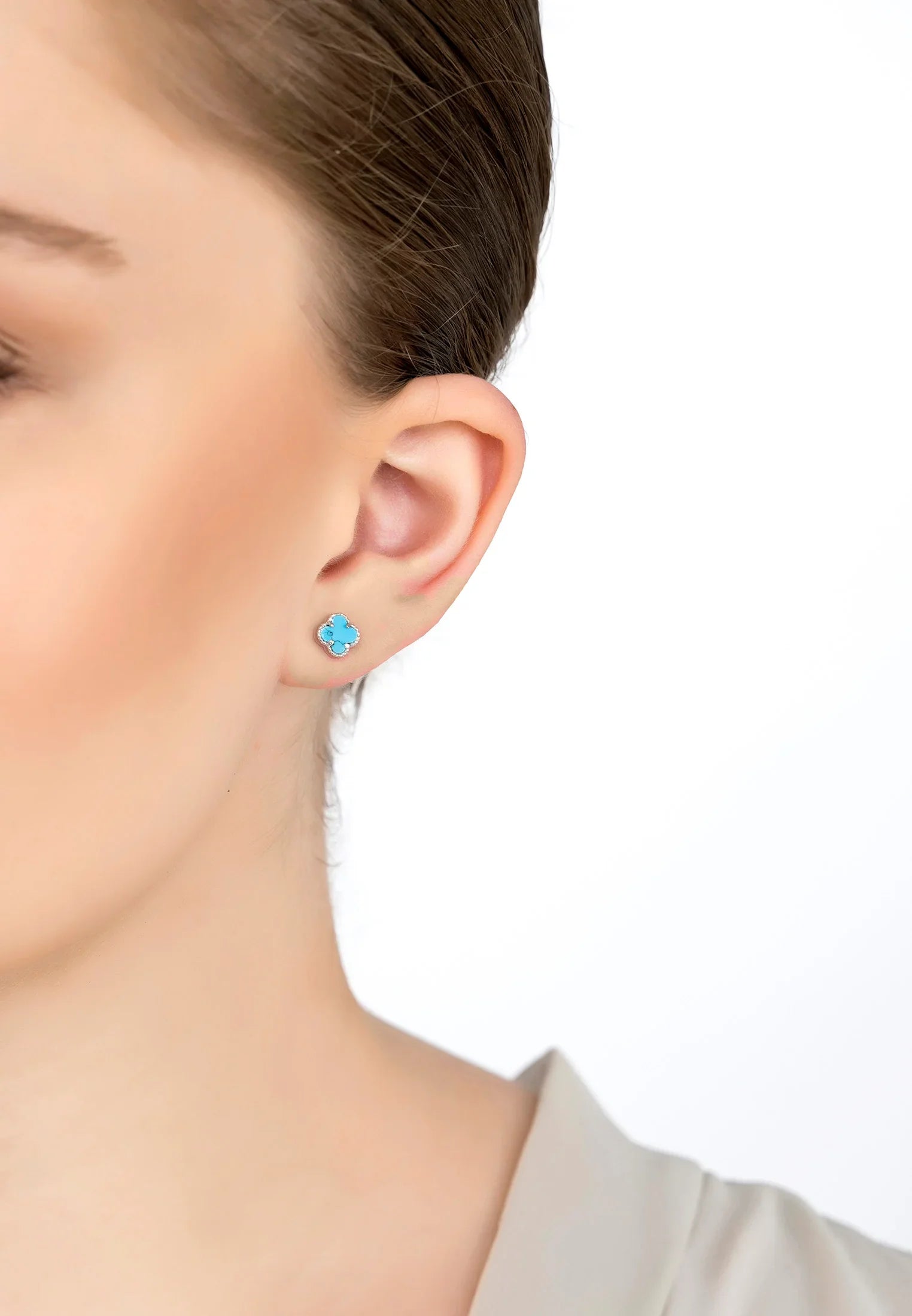 The earring worn by a model.